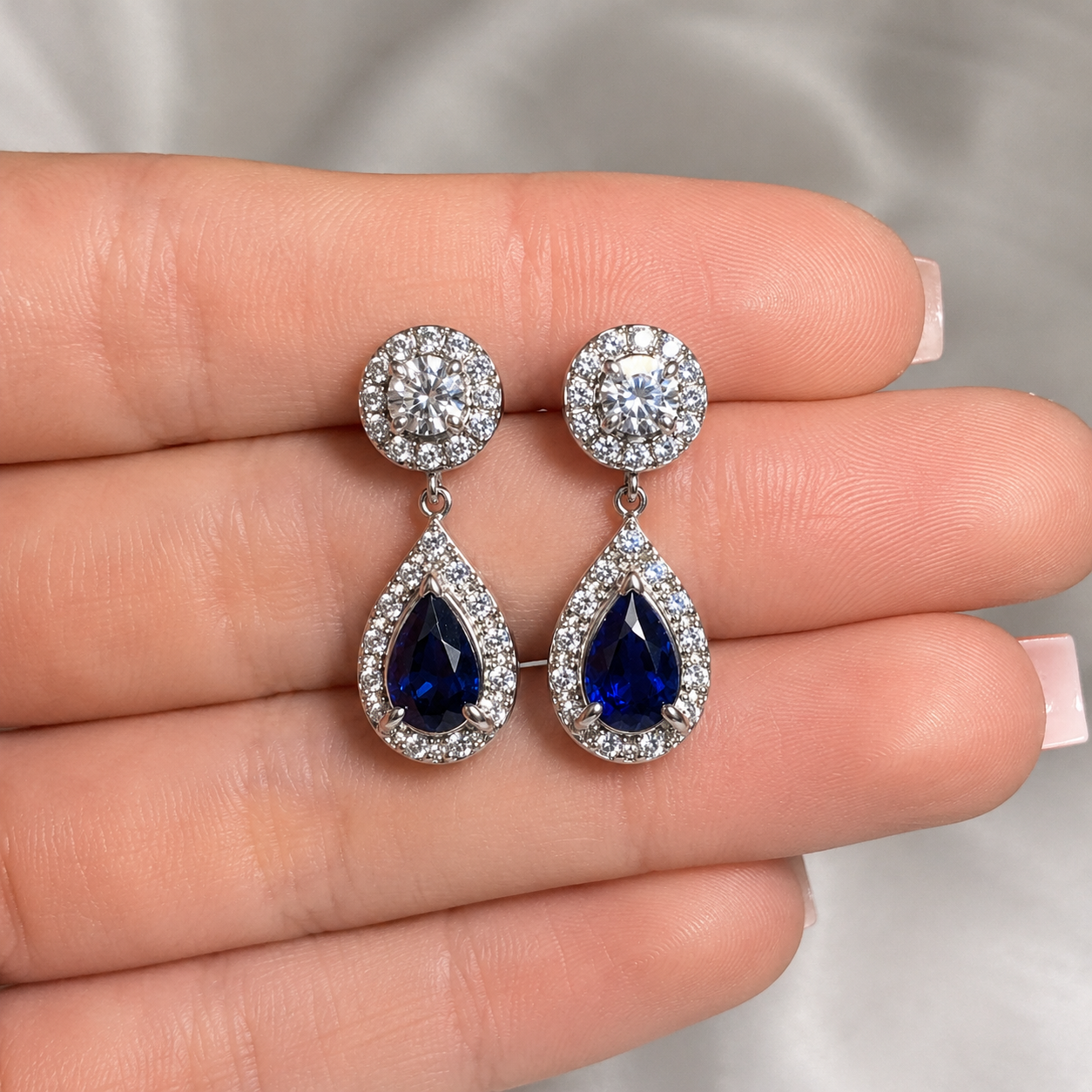 Sappire drop earrings model.png