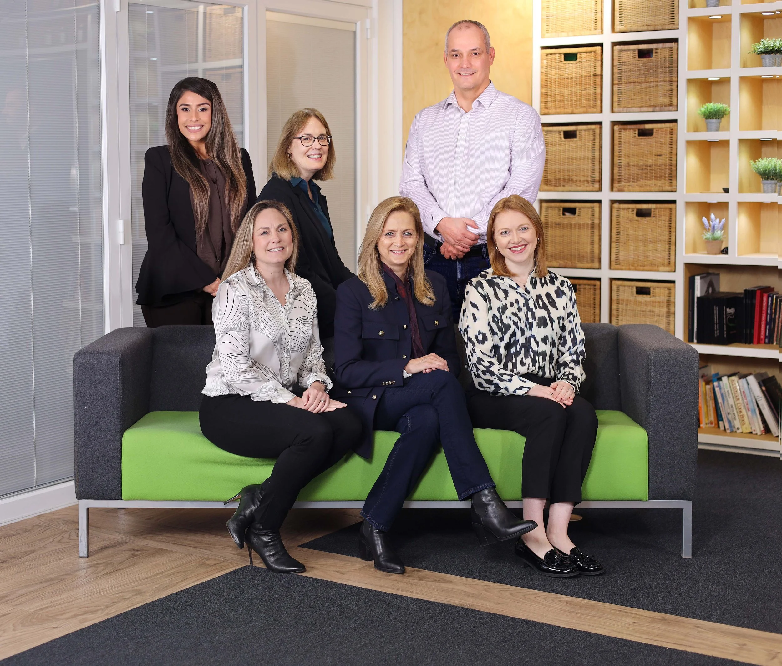 Monty's Bakehouse sales team on green and grey sofa