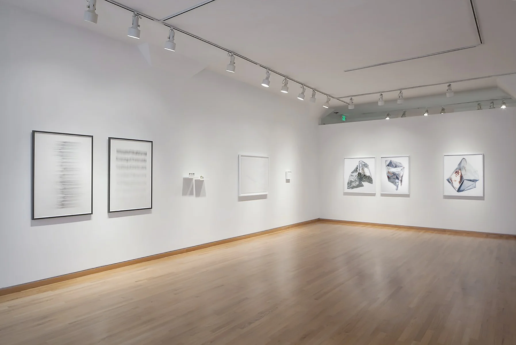Luminous Installation view, Stephen Wirtz Gallery In Luminous, a group of arts formally engage in various degrees with reflectivity, translucency, and whiteness are gathered. Each artist explores the multi-functionality of imagery through the absence of color as a way of examining the language of and crossover between abstraction and representation. Images, left to right: Claire Collette, Andrew Witrak, Tressa Pack, Jennifer Brandon