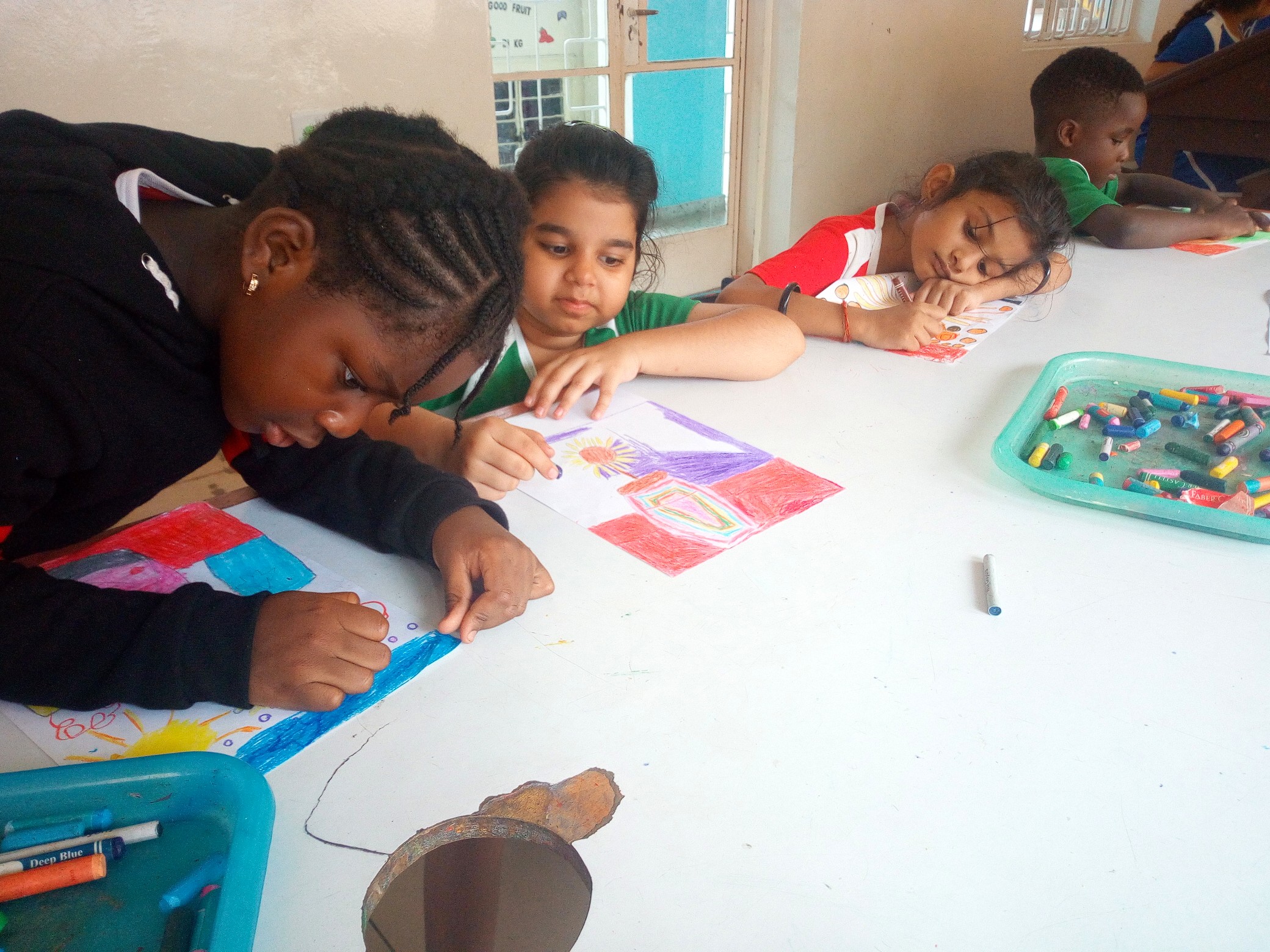 First graders drew their version of “Sunflowers” by Vincent van Gogh in art class.