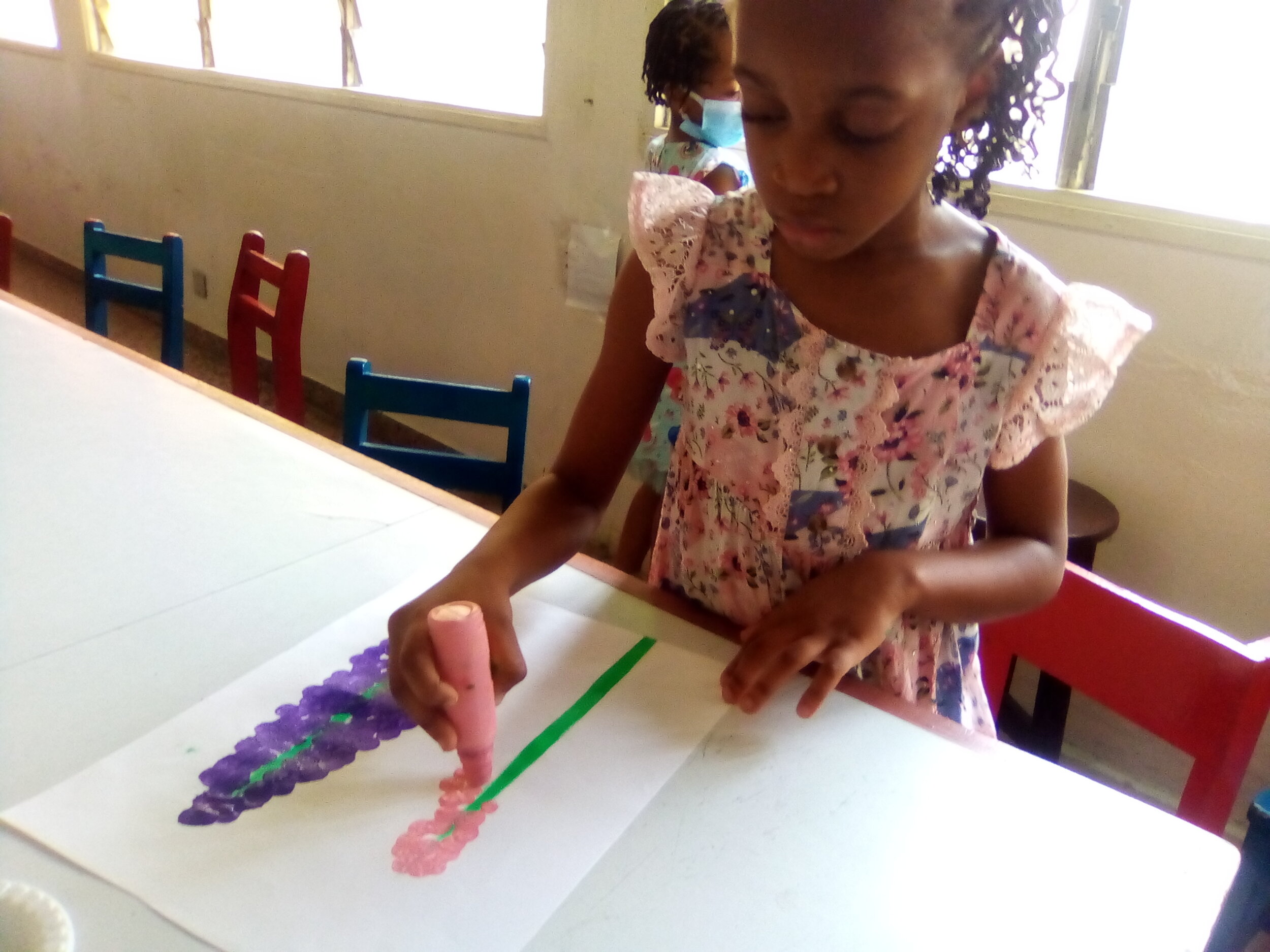  Preschoolers making Hyacinth flowers in Art class.  