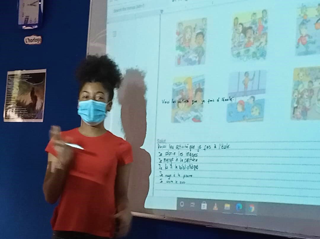  For Children’s Day, the student becomes the teacher. Here’s one student explaining the concept of a friendly letter during French class. 