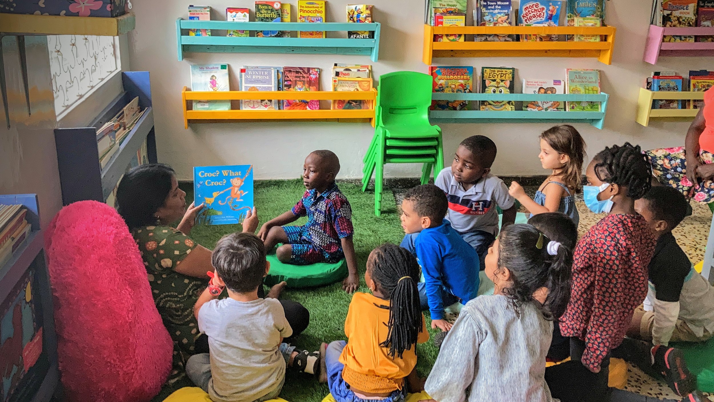   Pre-Kg enjoys story-time with Mrs. Seema in the preschool library!  