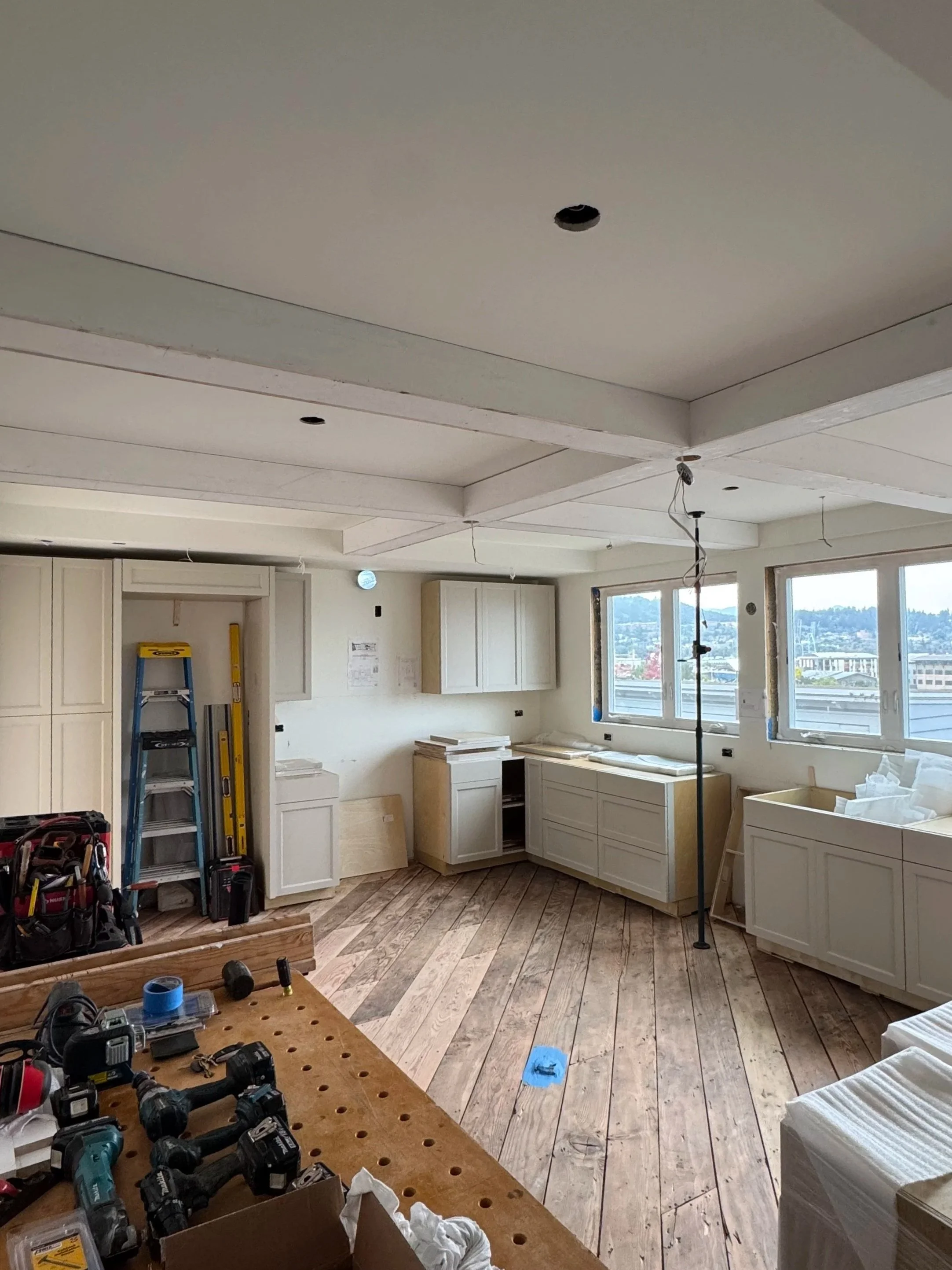Kitchen cabinets installed in a tidy construction site