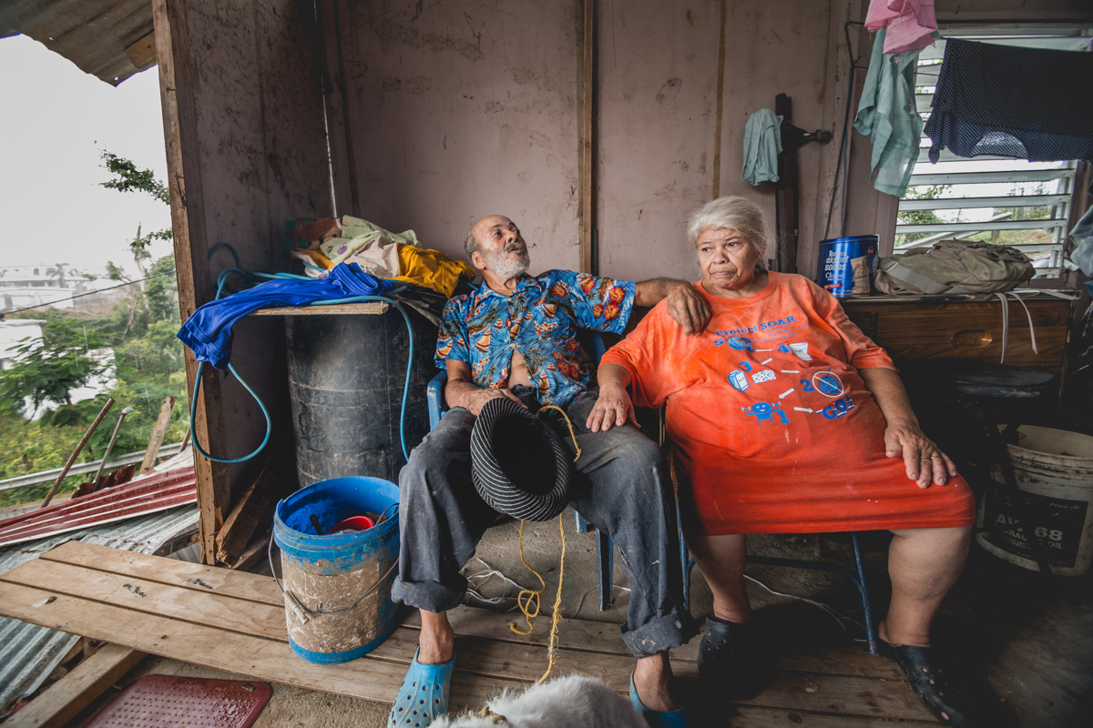 José (78) and María Vazquez (65) in their home. Their home was passed down to him verbally by his father who had built the house more than 70 years ago on abandoned land. Without an official document, José was unable to prove ownership of his land when FEMA contacted him to follow up on his claim, leaving him without eligibility for federal disaster relief. This is true for one out of every five Puerto Rican homes. December 27, 2017.