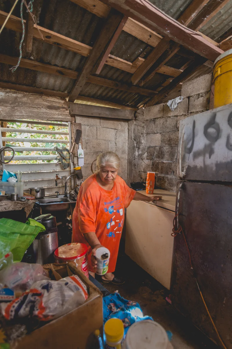 José (78) and María Vazquez (65) in their home. Their home was passed down to him verbally by his father who had built the house more than 70 years ago on abandoned land. Without an official document, José was unable to prove ownership of his land when FEMA contacted him to follow up on his claim, leaving him without eligibility for federal disaster relief. This is true for one out of every five Puerto Rican homes. December 27, 2017.
