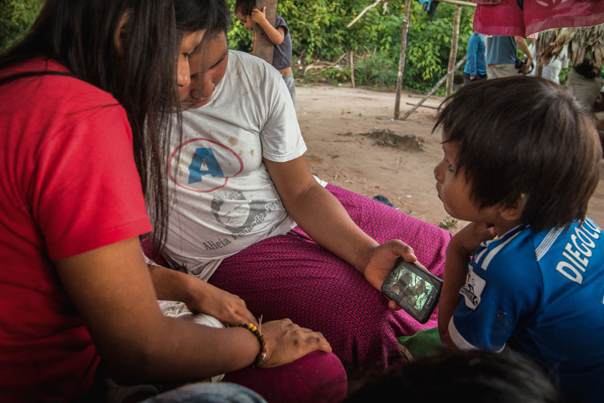 In the Mastigenka community of Tayakome , a group of kids spend a weekend afternoon huddled over a disconnected smartphone watching a movie dubbed in Spanish. Even though technology is seen in the restricted native community, they lack a high school and cultural traditions. A large amount of their youth are leaving the community to pursue a higher education but are immediately labeled as deserters by their families and not allowed to return. April 22, 2016.