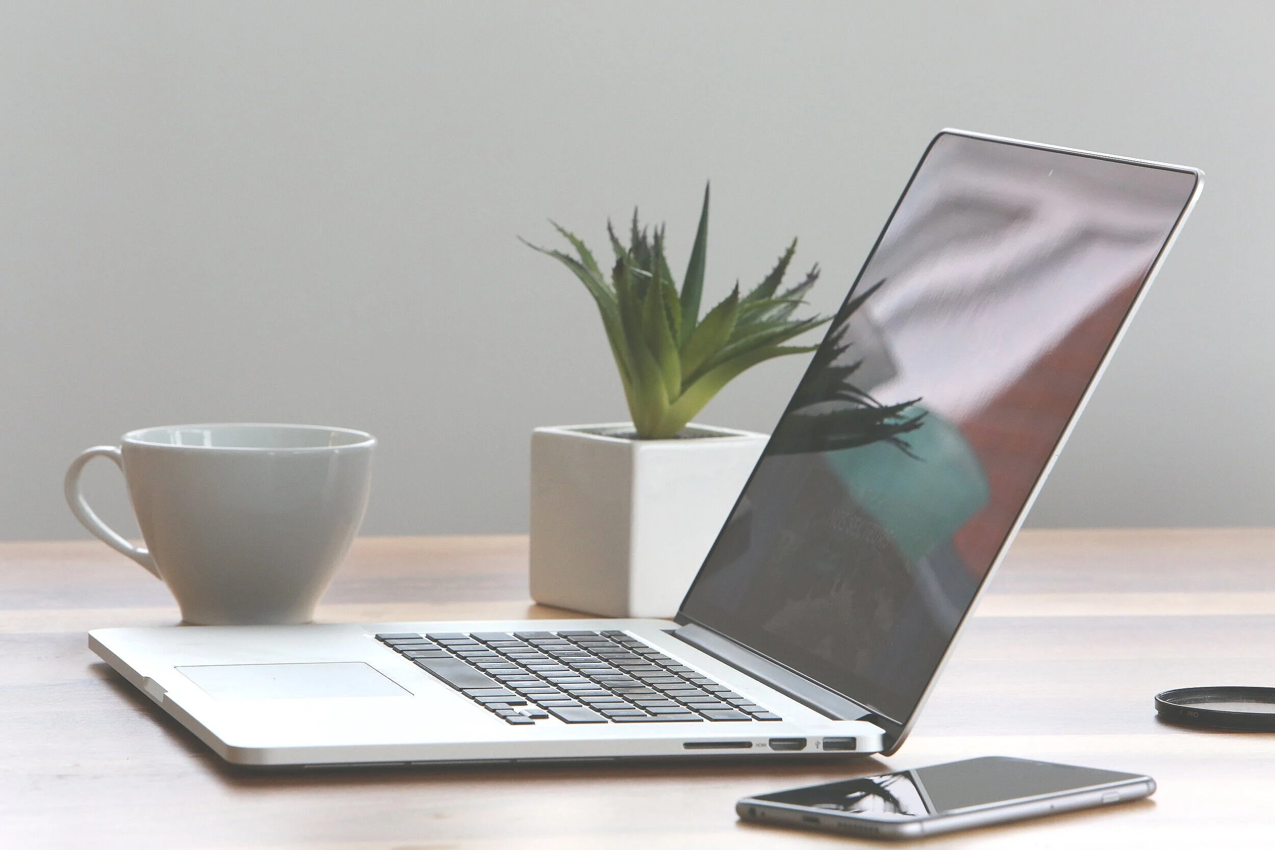 Canva+-+Silver+Laptop+and+White+Cup+on+Table.jpg