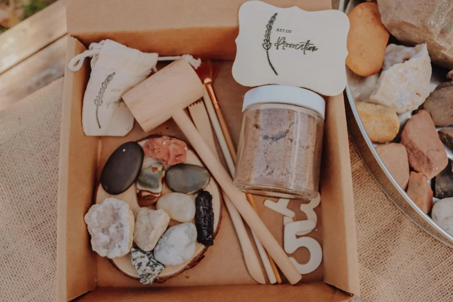 Our rock play exploration kit is live on our website! 
.
This kit includes:
10 assorted rocks 
.
A wood mallet, pick and brush for a more in depth study.
.
Kinetic sand 
.
And wood numbers 1-10 
.
This is a great way to begin a rock and mineral study