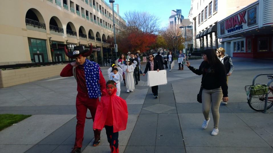  John Dryden (as a Diablo) and the ensemble make their way down K Street (Sacramento) to begin a performance of “La Pastorela de Sacramento,” a moving street theatre production that staged scenes in front of the Convention Center, IMAX theatre, a Law