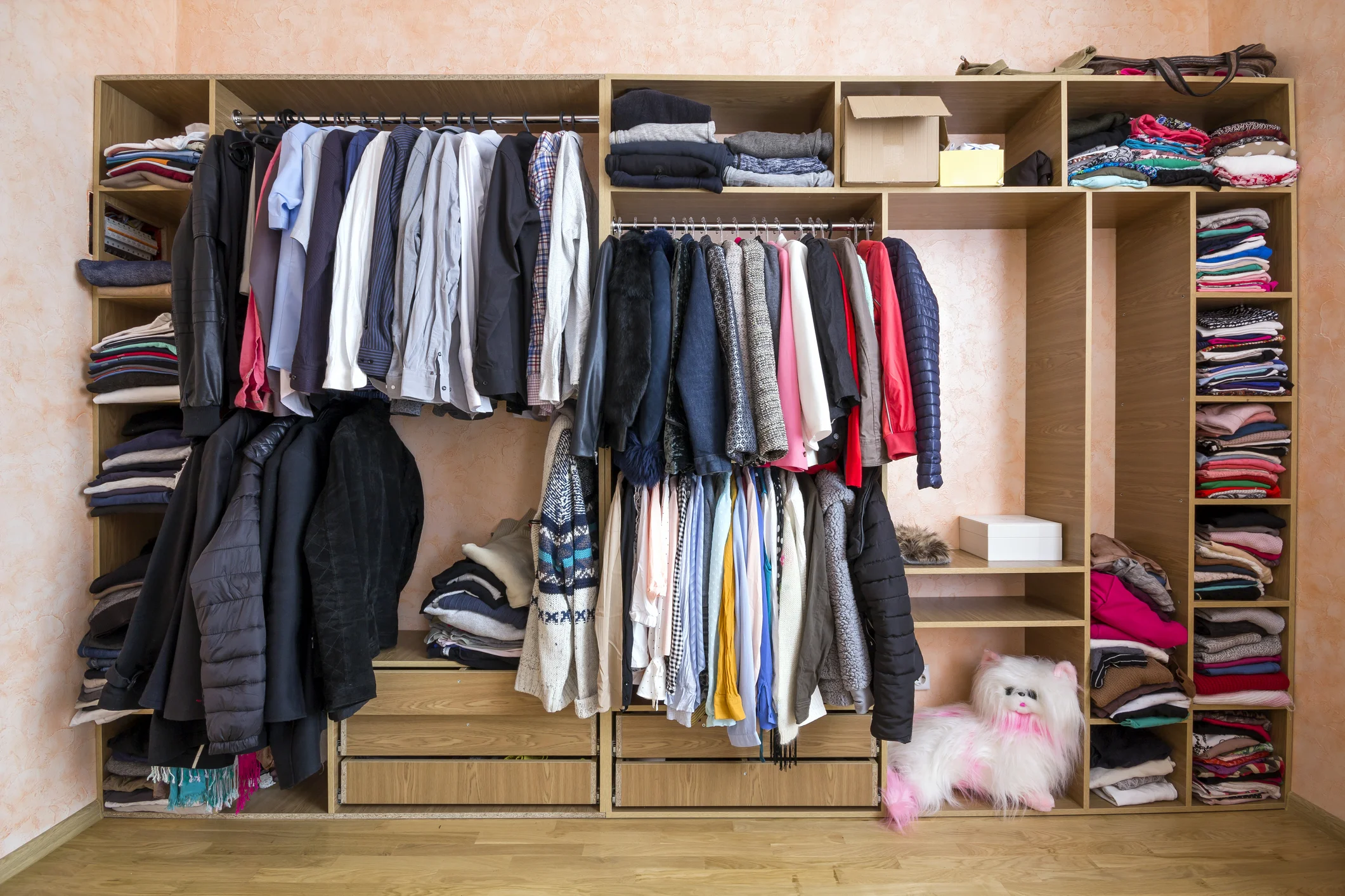 wardrobe-full-of-different-men-and-woman-clothes-105602327.jpg