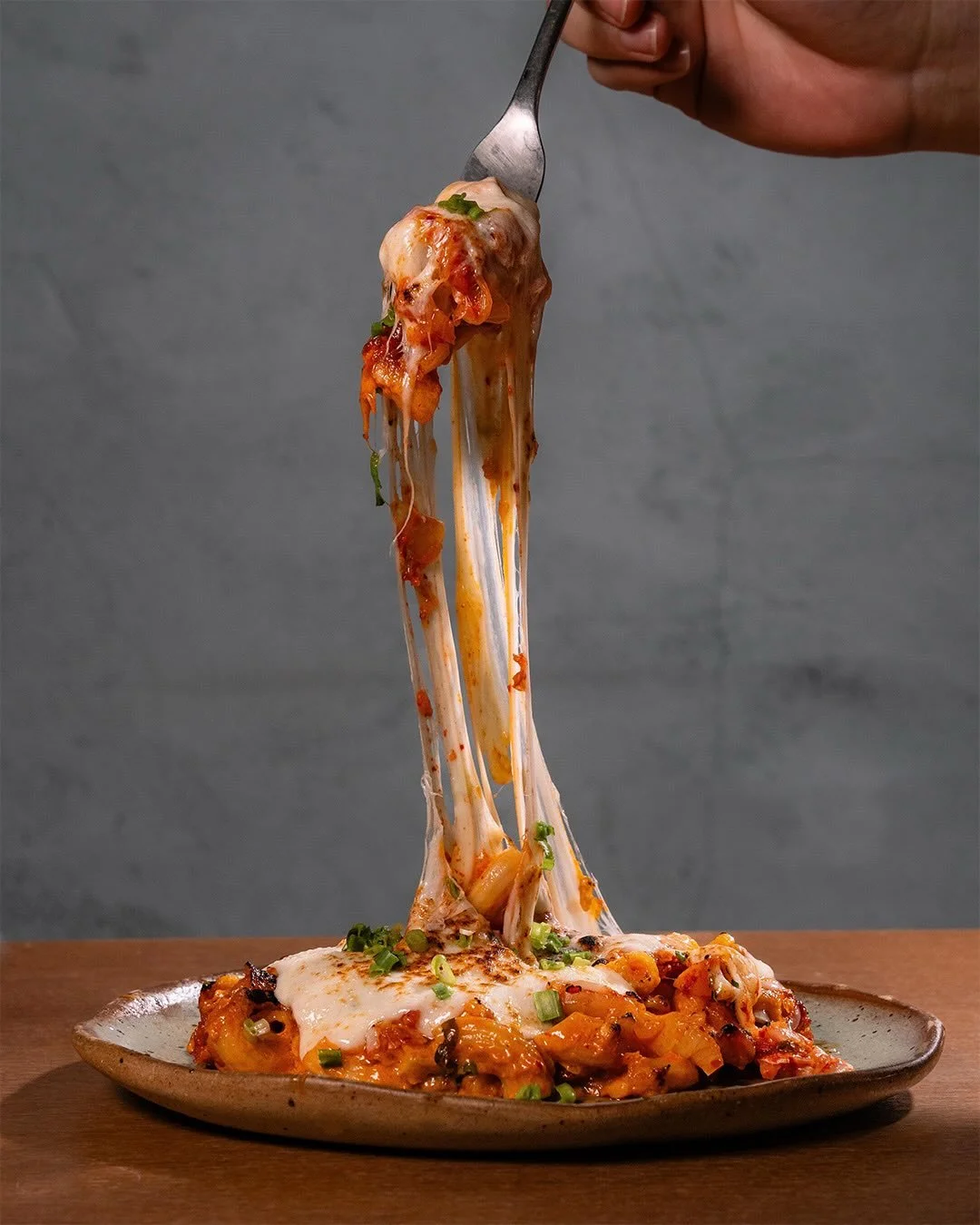 We may have overdone the cheese.

Buldak Mac &amp; Cheese
Chicken thigh, kimchi, mozzarella, spring onions.

Available for lunch and dinner.