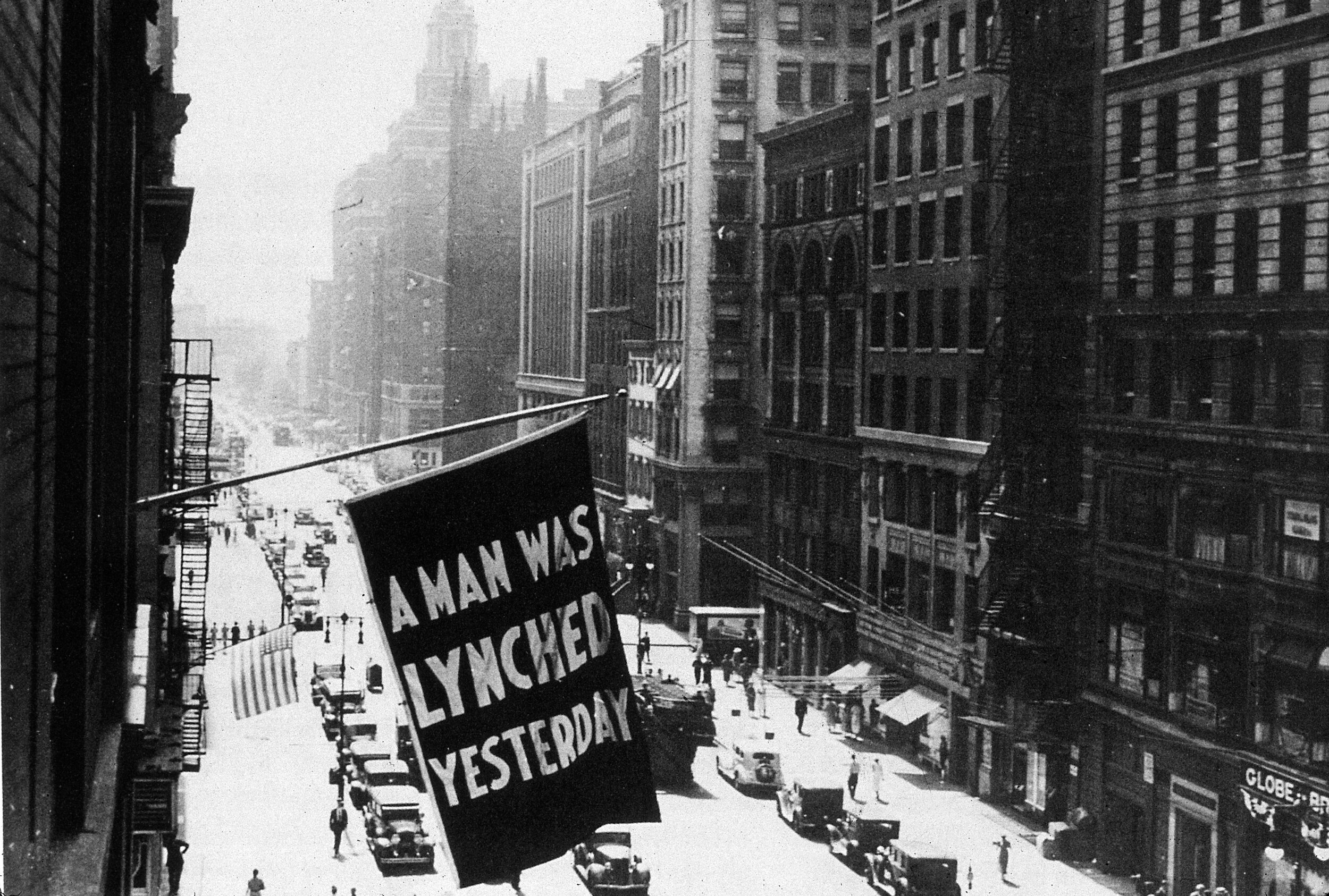 The National Association for the Advancement of Colored People would fly a flag from its window of in Fifth Avenue each time a lynching took place. Unknown photographer, NYC 1936.