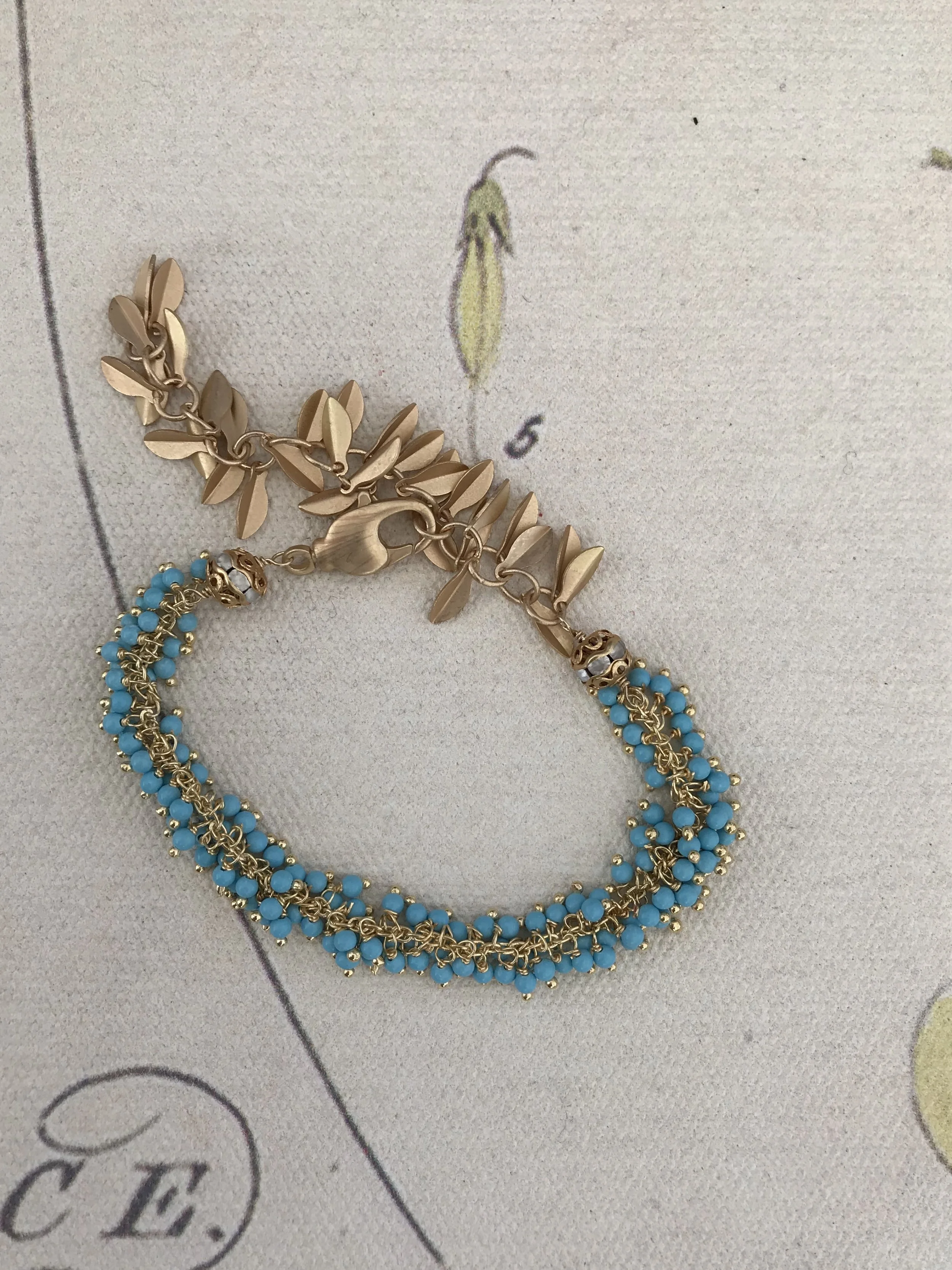 Turquoise dangles and matte gold fringe bracelet