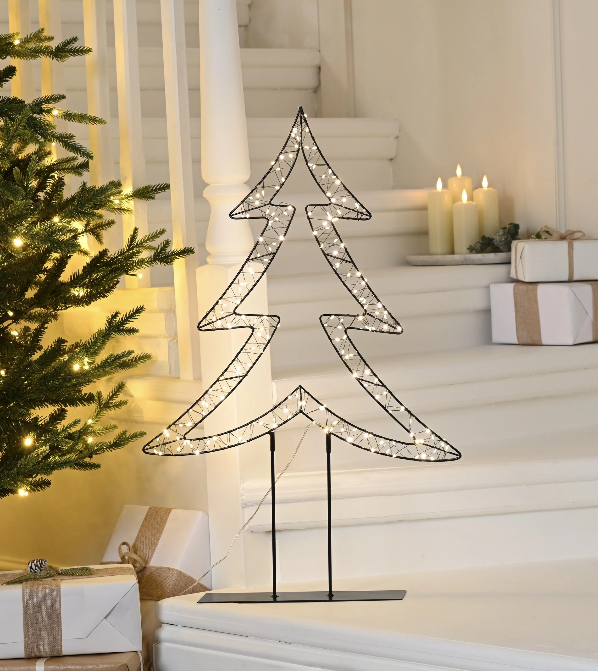 Twinkling lit tree with warm white lights