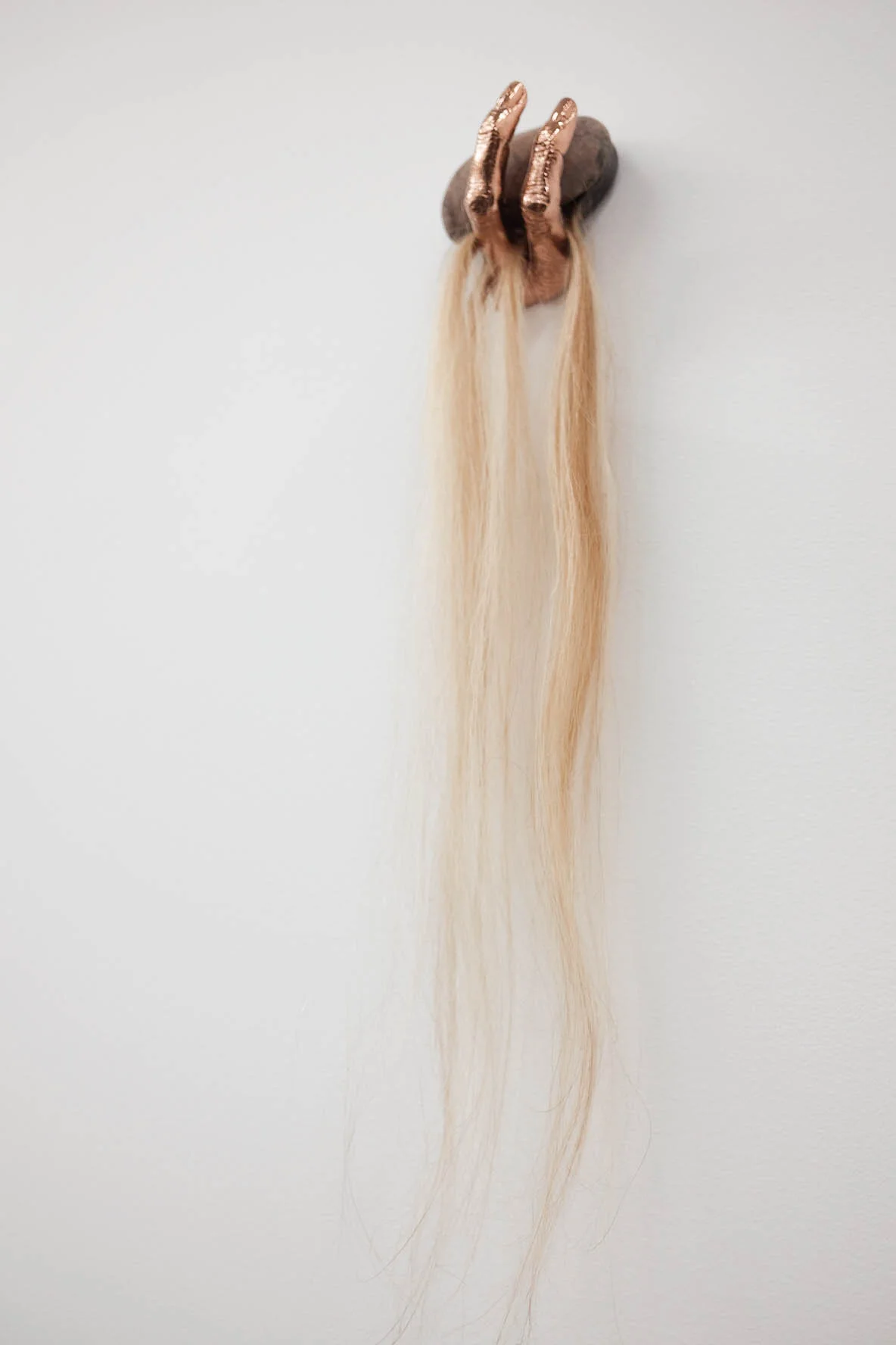 Karen Lofgren Spirit Tourist #2 (stone circle stone) , 2018 stone from the Isle of Arran, human hair, epoxy, keylock, copper plated bronze 20 x 4 x 3 in (50.8 x 10.2 x 7.6 cm)