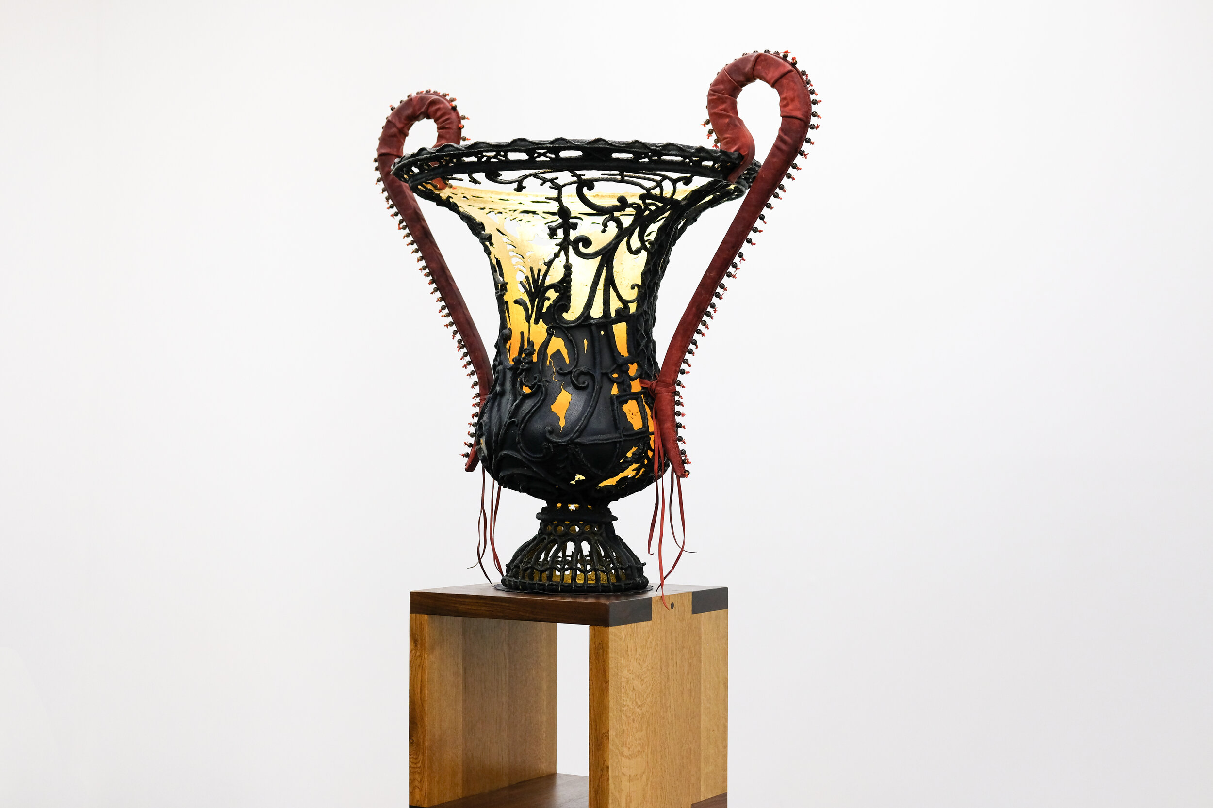   Four-in-hand , 2018 cast brass, leather, black tourmaline, coral and 24k gold 40 3/4 x 41 x 29 in (103.5 x 104.1 x 73.7 cm) 