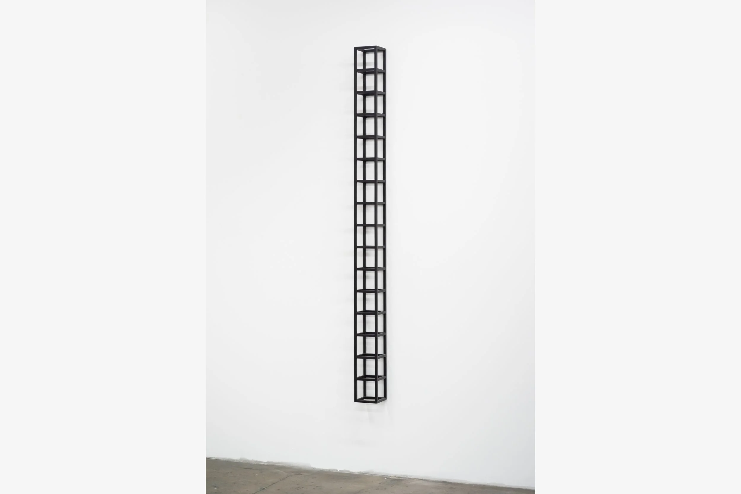  Sol LeWitt  Wall Piece (16 Modules High) , 1988 pinewood construction painted in black 76 1/2 x 5 1/4 x 5 1/4 in&nbsp; (194.3 x 13.3 x 13.3 cm) 