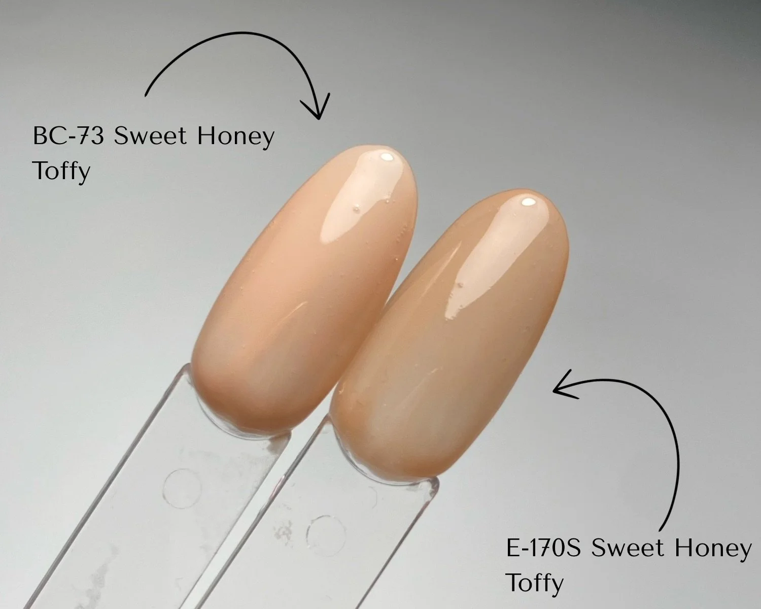 Side-by-side comparison of KOKOIST Bottle'N Go BC-73 Sweet Honey Toffy and Excel Color E-170S Sweet Honey Toffy swatched on clear swatch sticks.