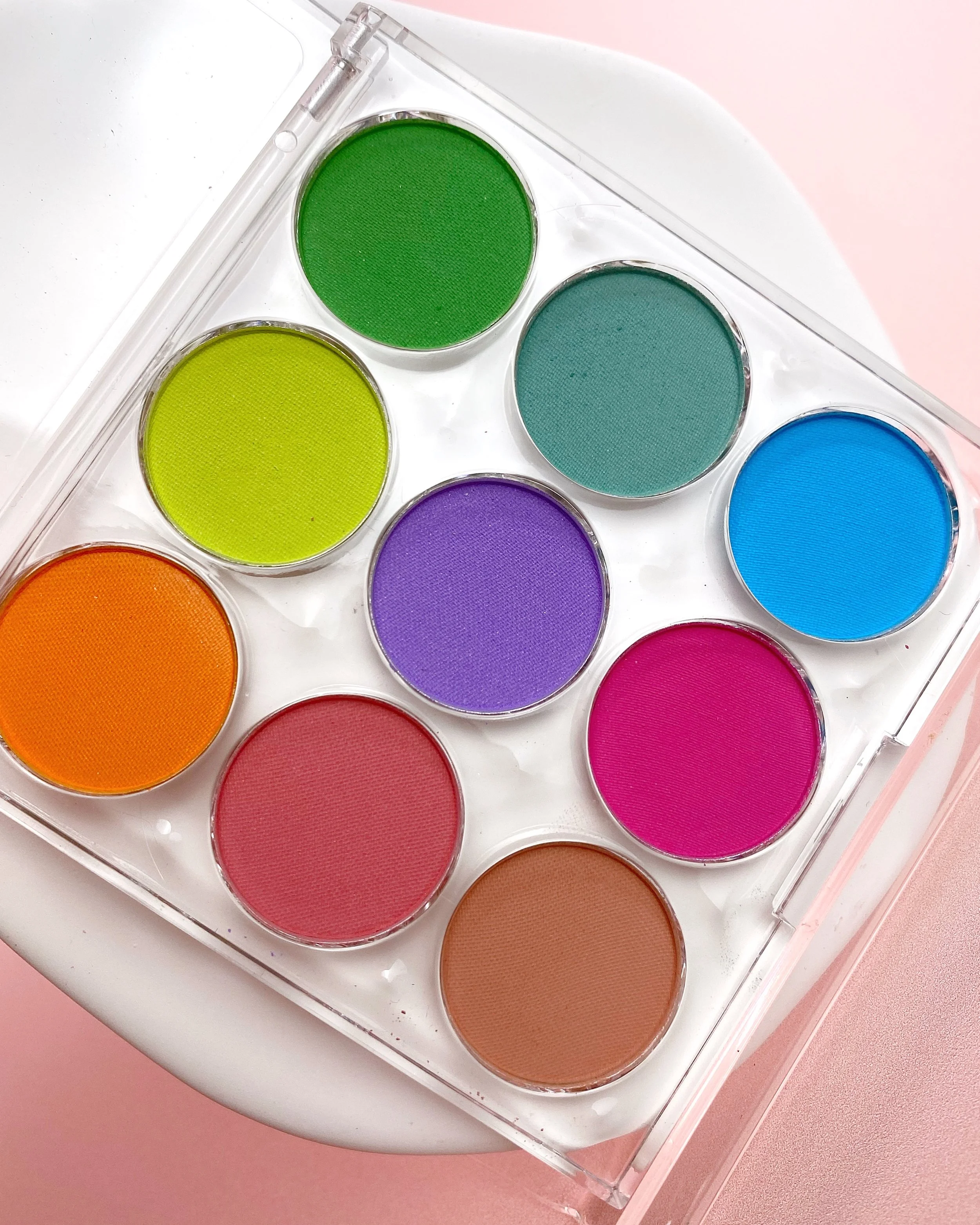 Vacation Nail Shop Soft Fade Gradient Palette in Arcade featuring nine matte powder pigments in orange, coral, hot pink, purple, blue, teal, green, chartreuse and tan for creating ombré and gradient nail art.