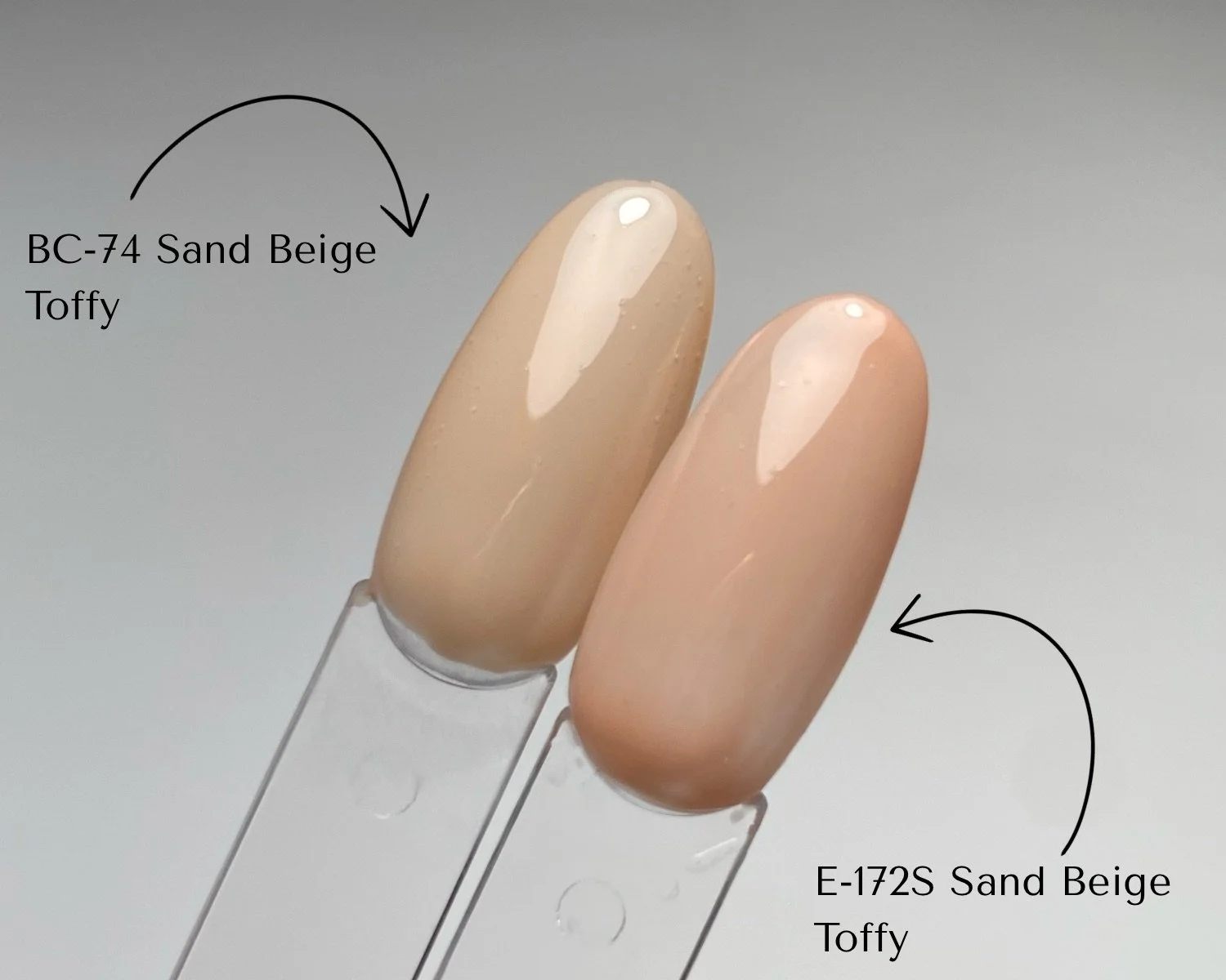Side-by-side comparison of KOKOIST Bottle'N Go BC-74 Sand Beige Toffy and Excel Color E-172S Sand Beige Toffy swatched on clear swatch sticks.