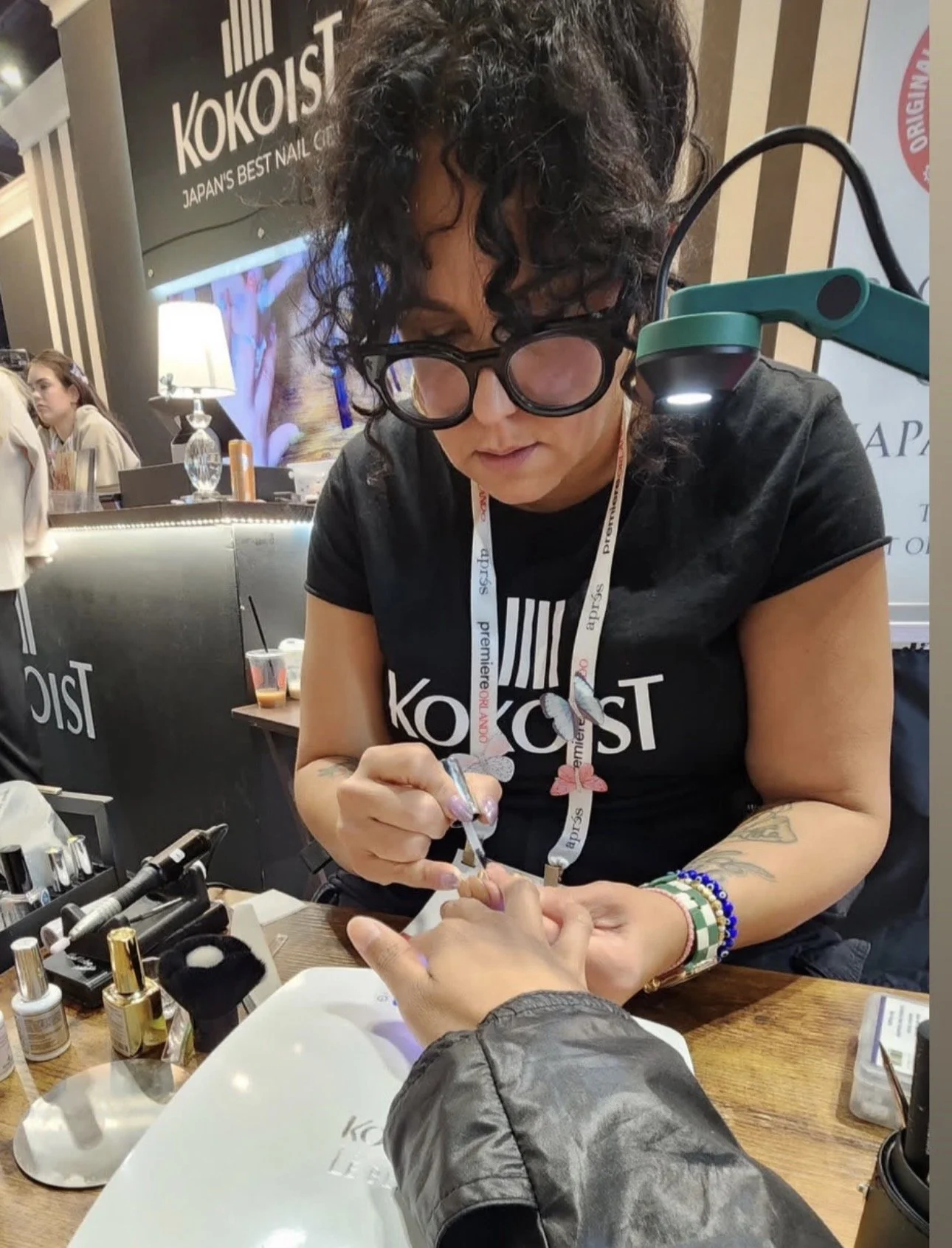 Kokoist USA educator Rachel Messick performing a live nail product demonstration at Premiere Orlando.