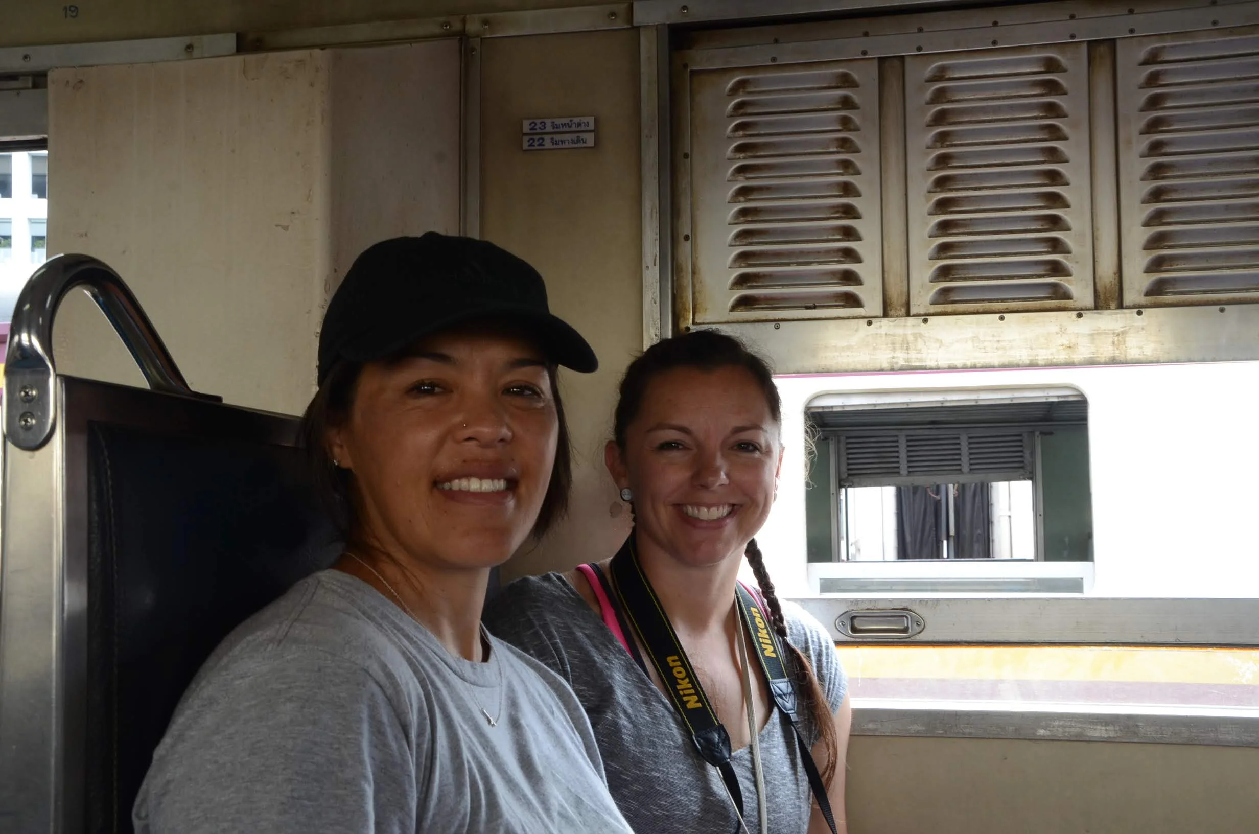 My travel buddy and I on the train. Notice the window is down to feel the breeze.