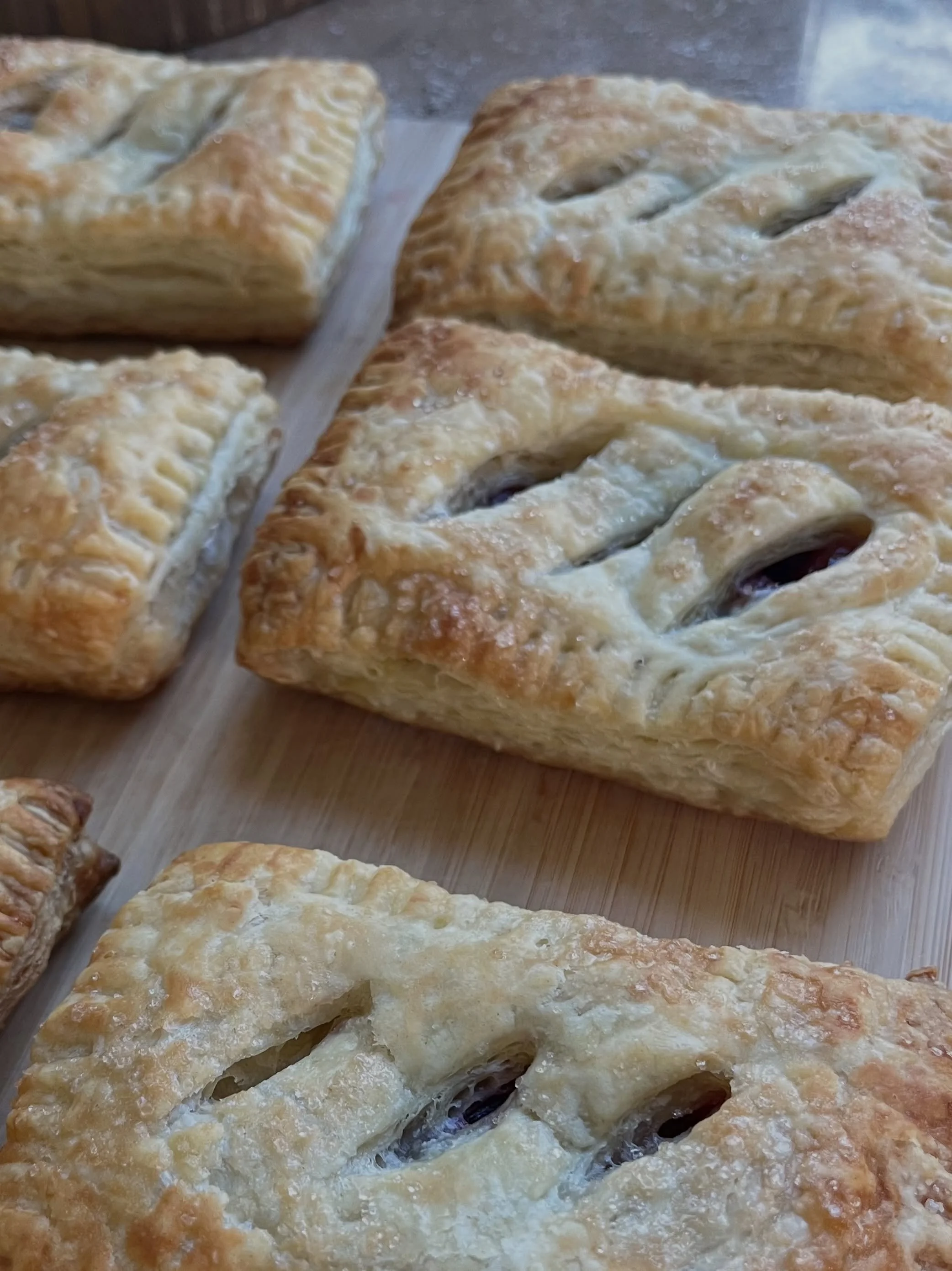 A friend gave me freshly picked cherries, so I turned them into vegan hand pies.

This was my first time working with puff pastry, and I spent the evening learning as I went. Walking to the grocery store for ingredients. Mulching the front garden. Pl