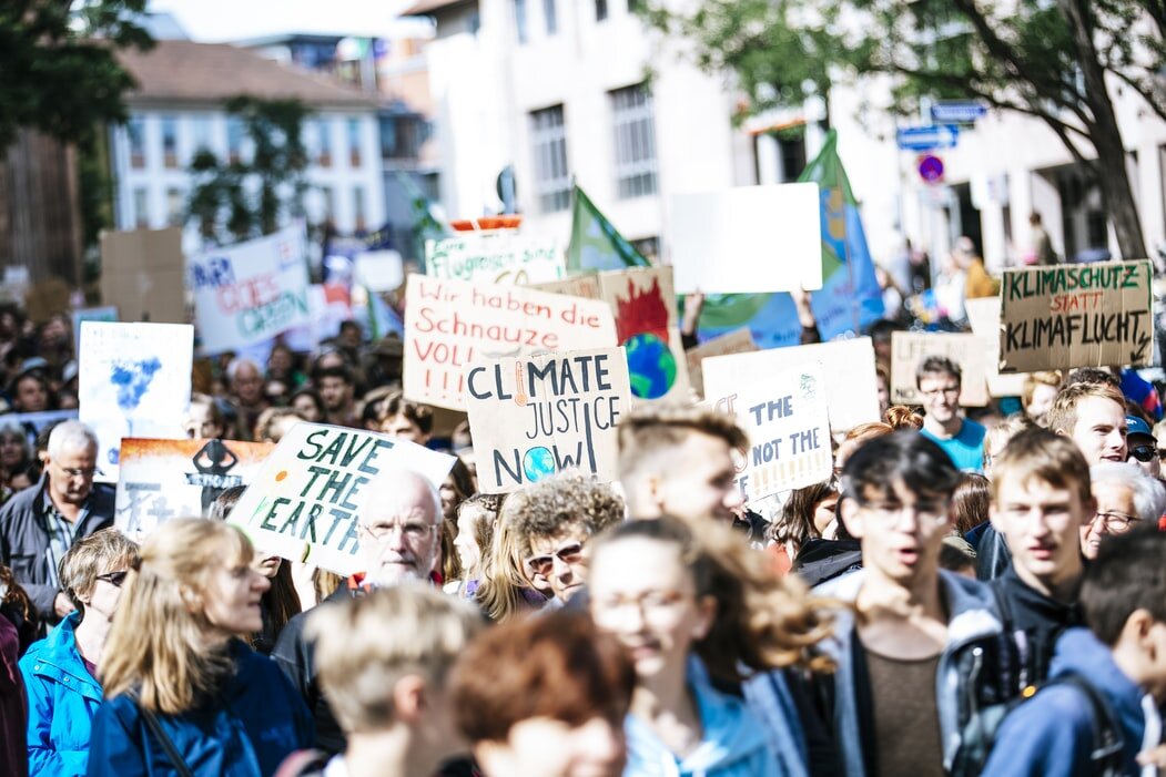 Protesting is a great way to involve yourself in climate action. When it is safe to do so, why not get involved in a climate protest in your local area? Photo: Markus Spiske (Unsplash).