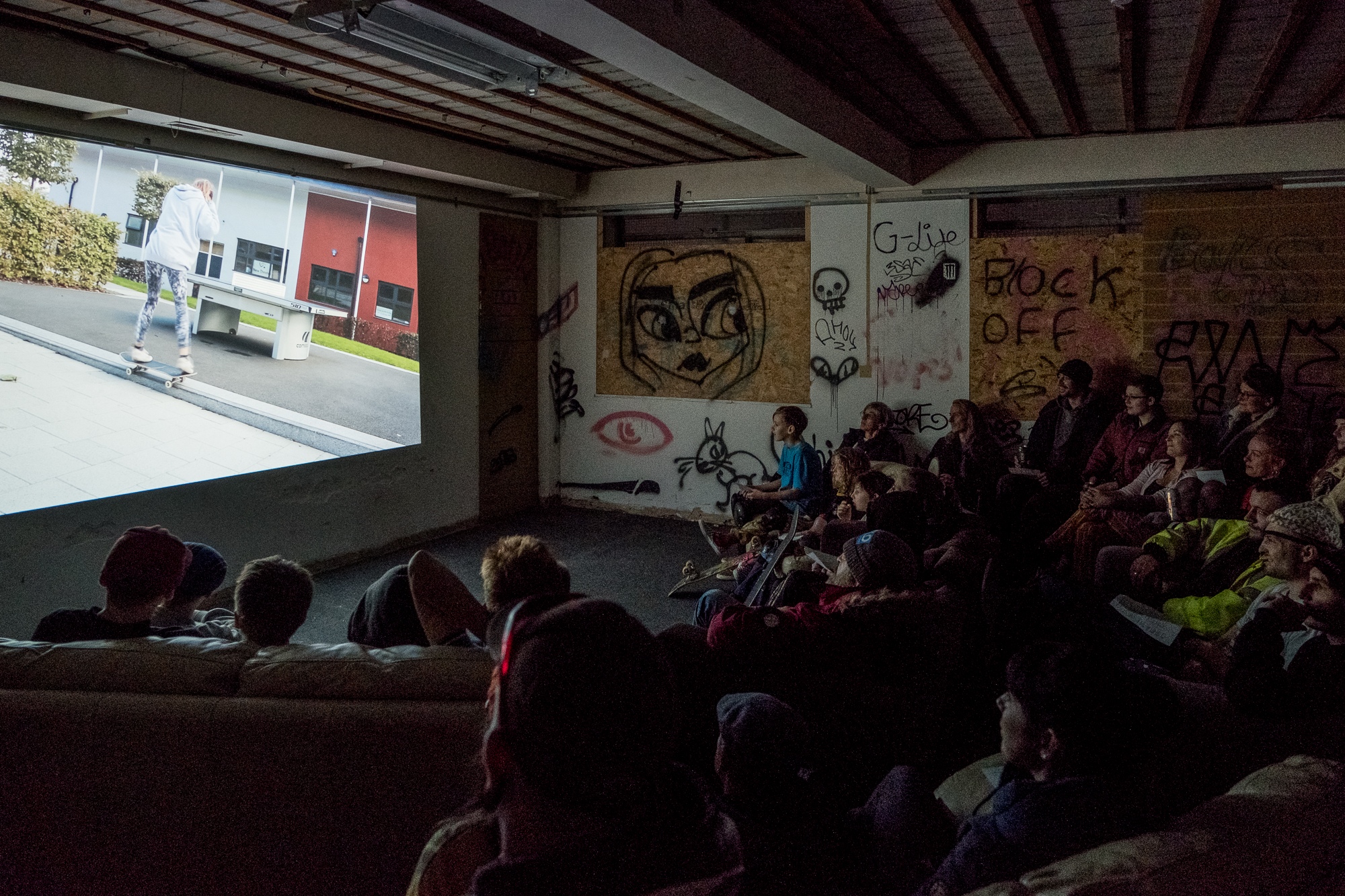  Audience watching one of several entries to the City Circuit competition as part of  Skate Nottingham ’s Film Festival at Flo Skatepark, 16-17 November, 2018. 
