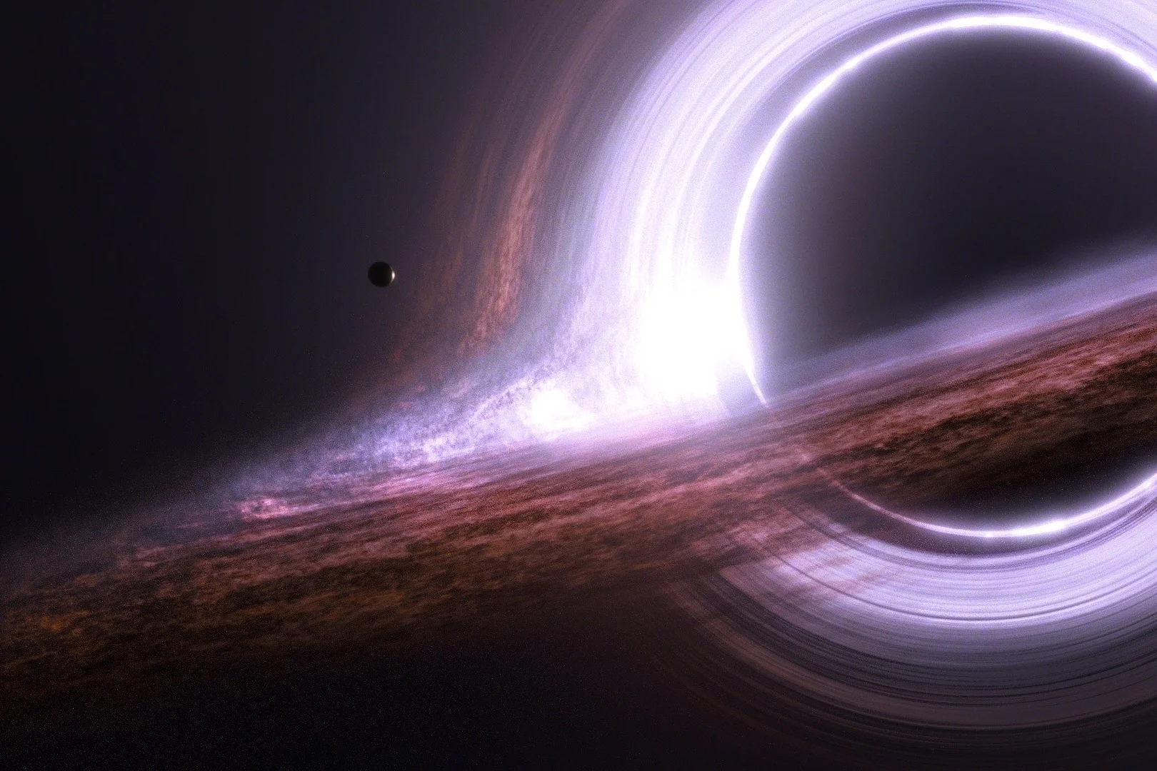 These computer-generated images created for the movie Interstellar were surprisingly accurate renditions of what we now know black holes to look like. Credit: Interstellar