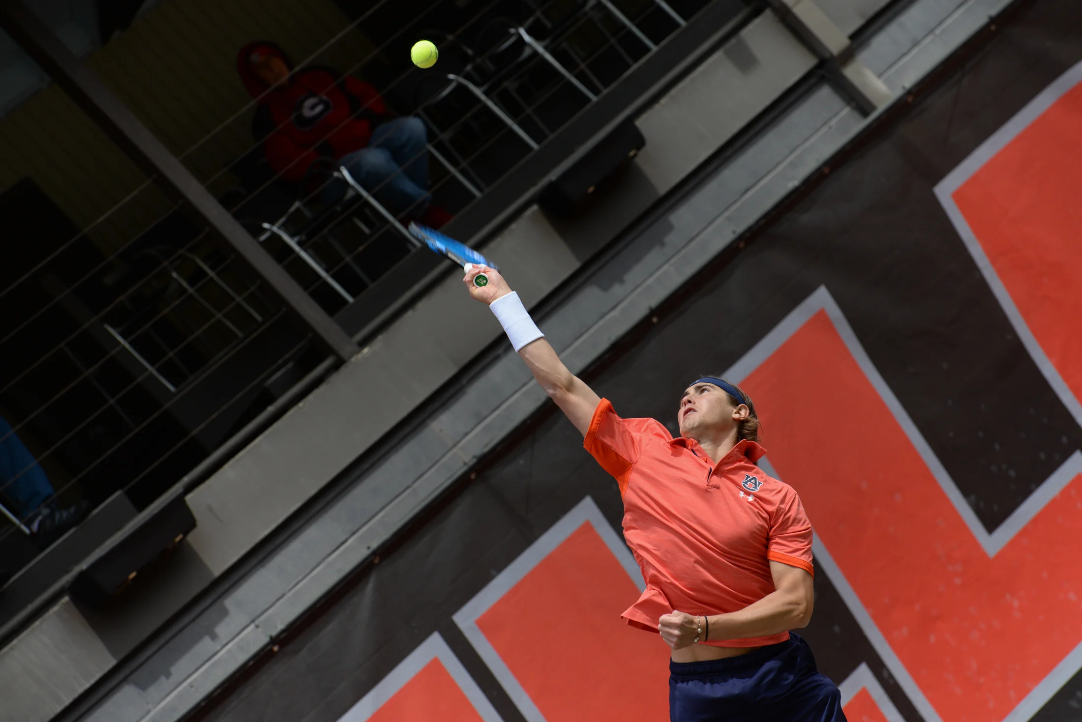 An Auburn University player serves during a match against Georgia on Mar. 31, 2019 at the Dan Magill Tennis Complex in Athens, Georgia. Georgia defeated Auburn 4-1. (Photo/Julian Alexander)