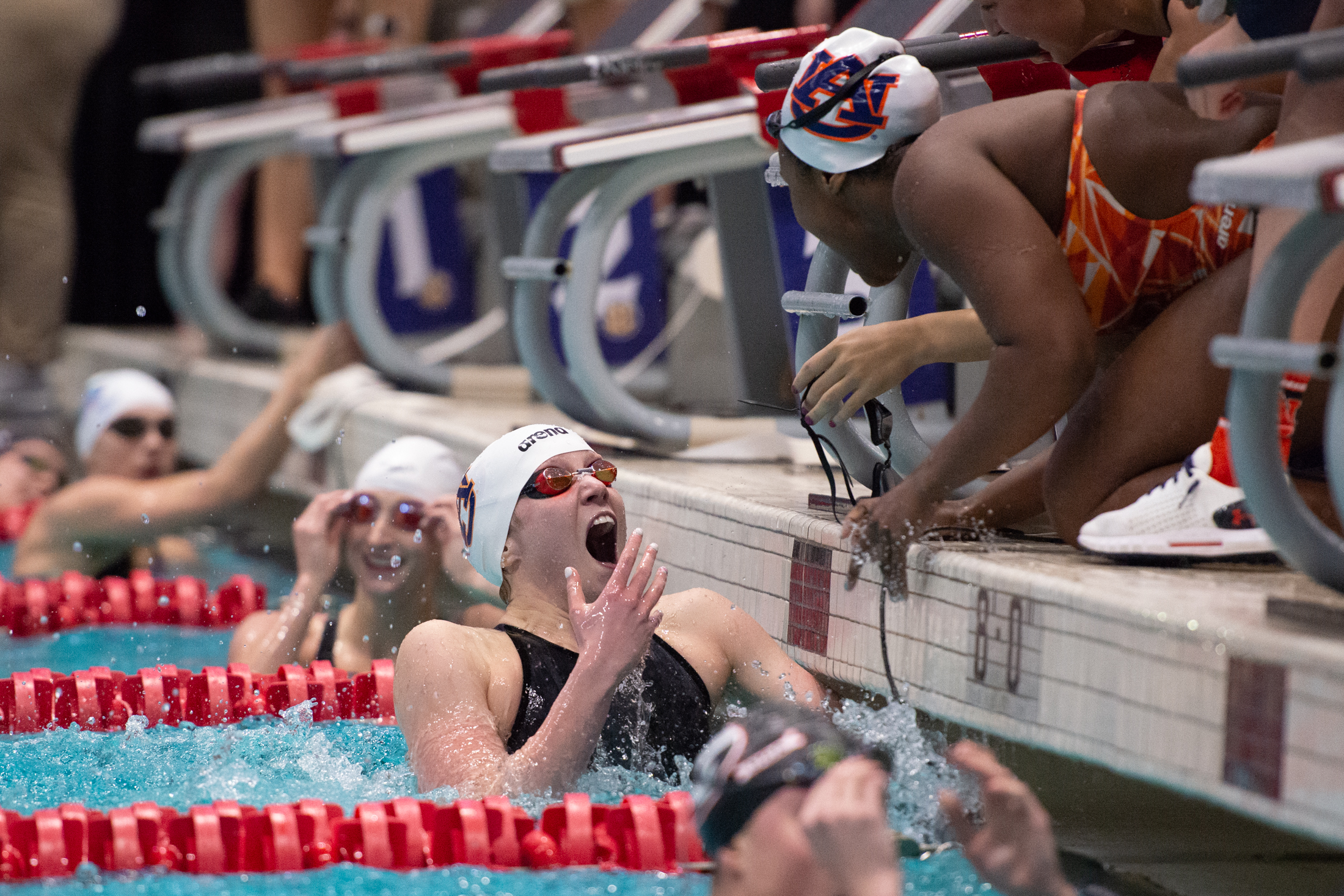  Erin Falconer of Auburn celebrates after winning the 200 yard freestyle relay during finals on the evening of Feb. 21, 2019 in the Gabirelsen Natatorium in Athens, Georgia. Courtney Harnish of Georgia placed third. (Photo/Julian Alexander) 