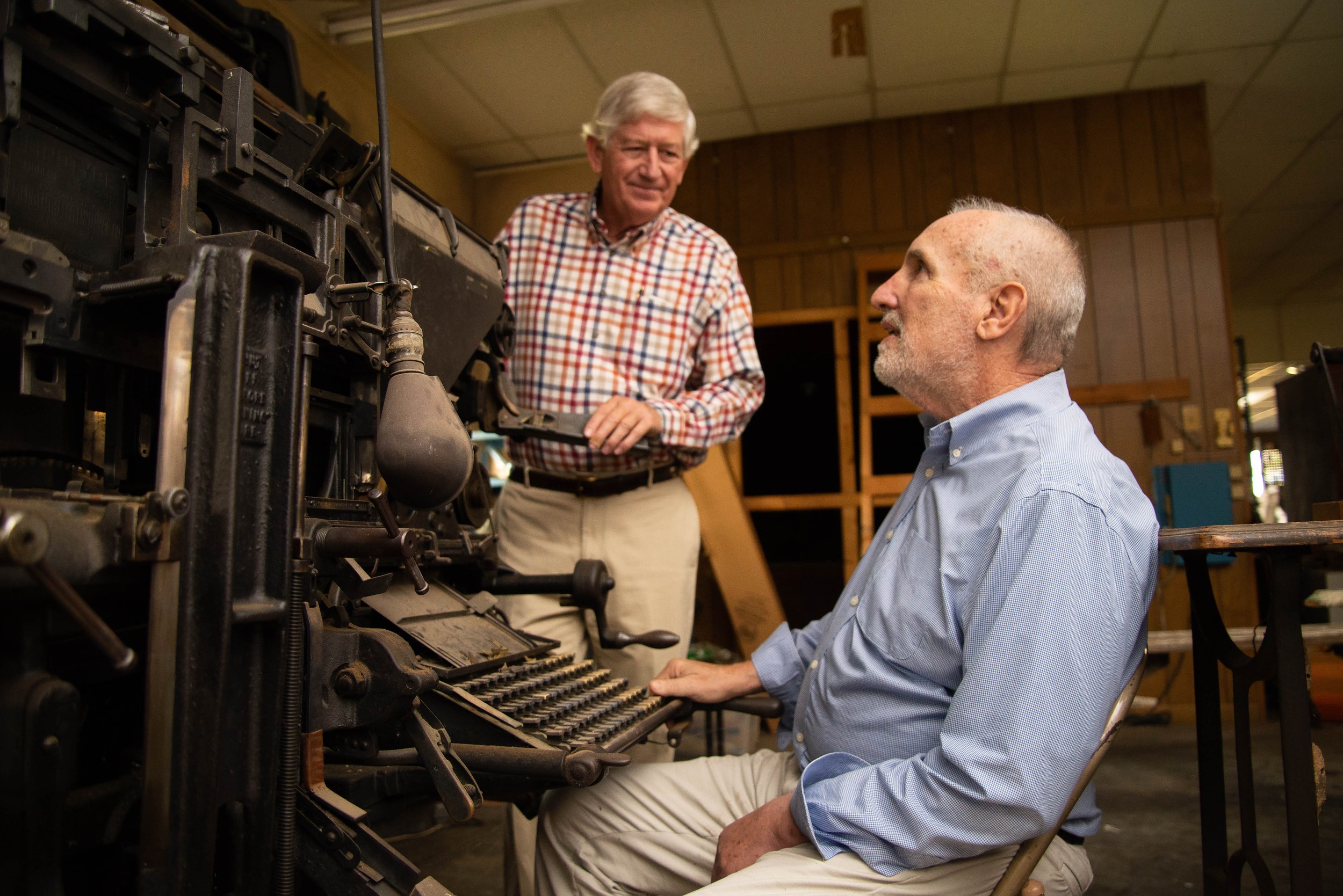  Oglethorpe Echo editor and publisher Ralph Maxwell sits at a vintage linotype machine while visiting with Dink NeSmith at The Echo’s office on Tuesday, Oct. 21, 2021 in Lexington, Georgia. NeSmith stepped in to save the paper when Maxwell announced 
