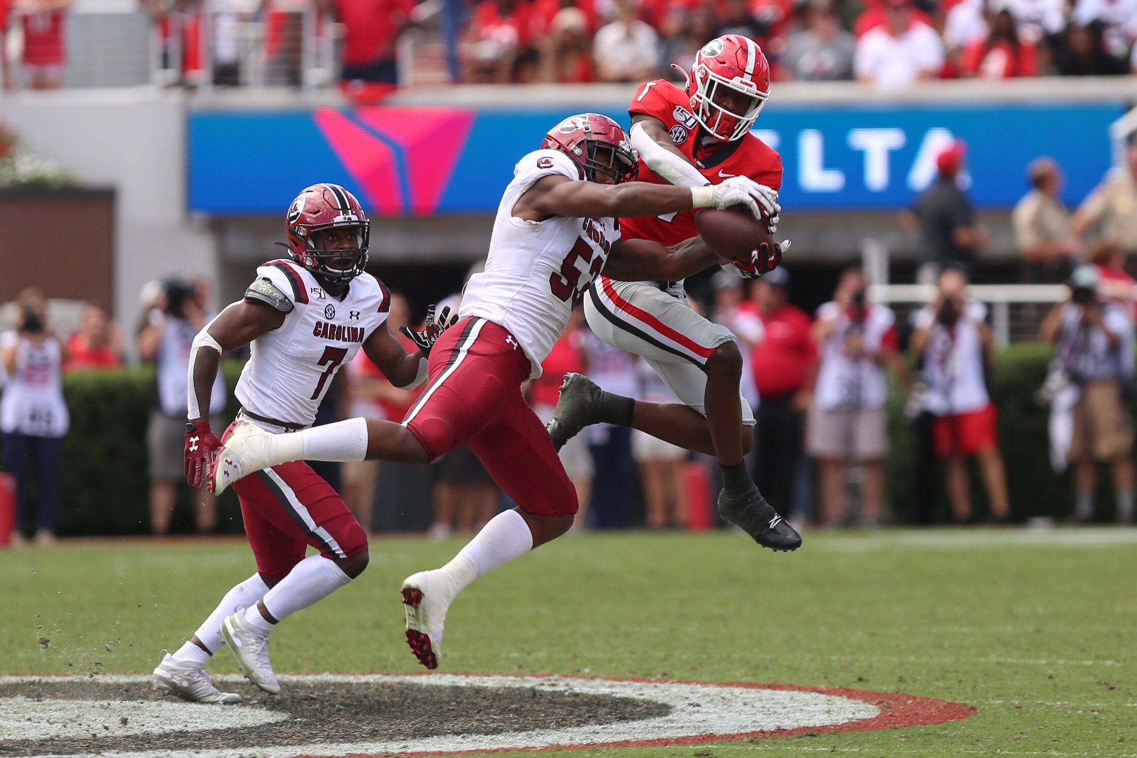  South Carolina linebacker Ernest Jones snatches the ball from Georgia wide receiver George Pickens (1) during a game on Oct. 12, 2019, in Sanford Stadium in Athens, Georgia. The Bulldogs lost in overtime 20-17. (Photo/Julian Alexander) 