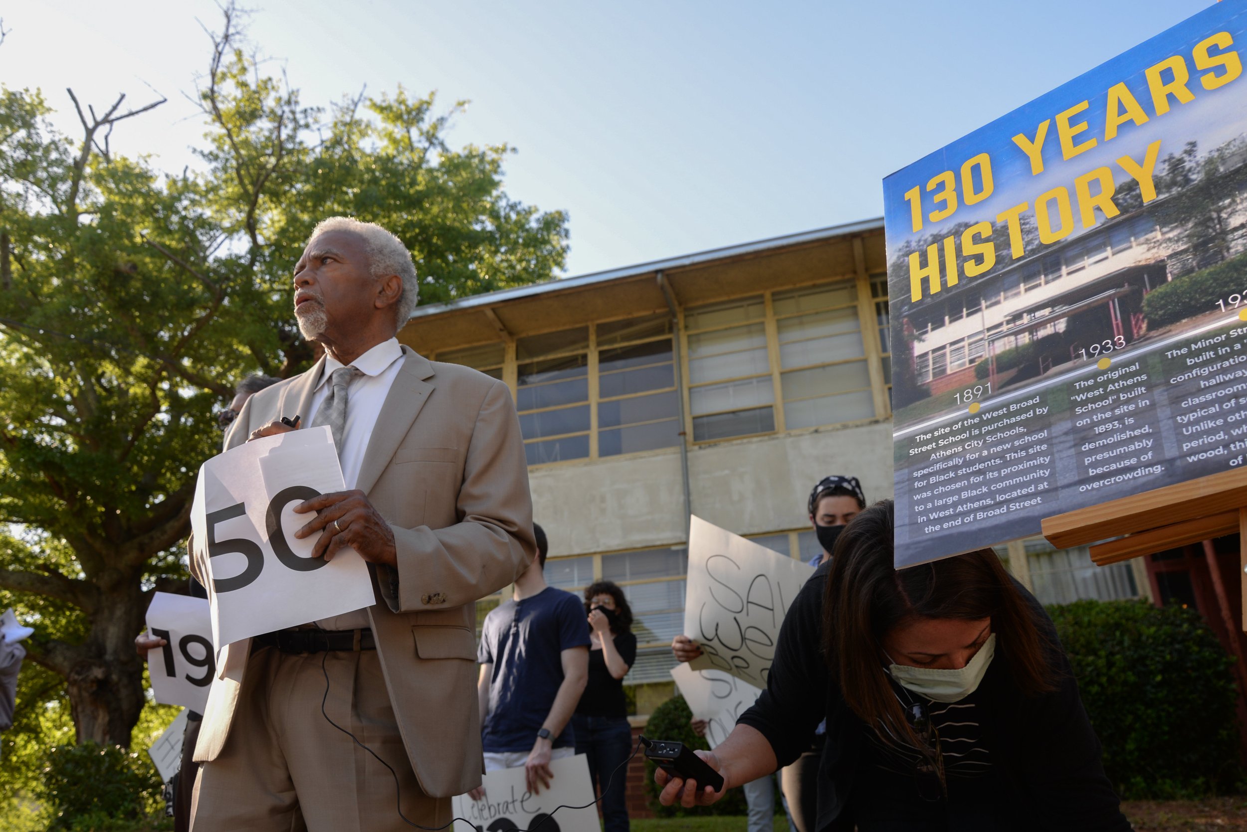  Fred Smith, a member of a community committee that is working with the school board to advise on the fate of the West Broad Street School, prepares to speak at a demonstration of support for the historic structure on Thursday, May 13, 2021 in Athens