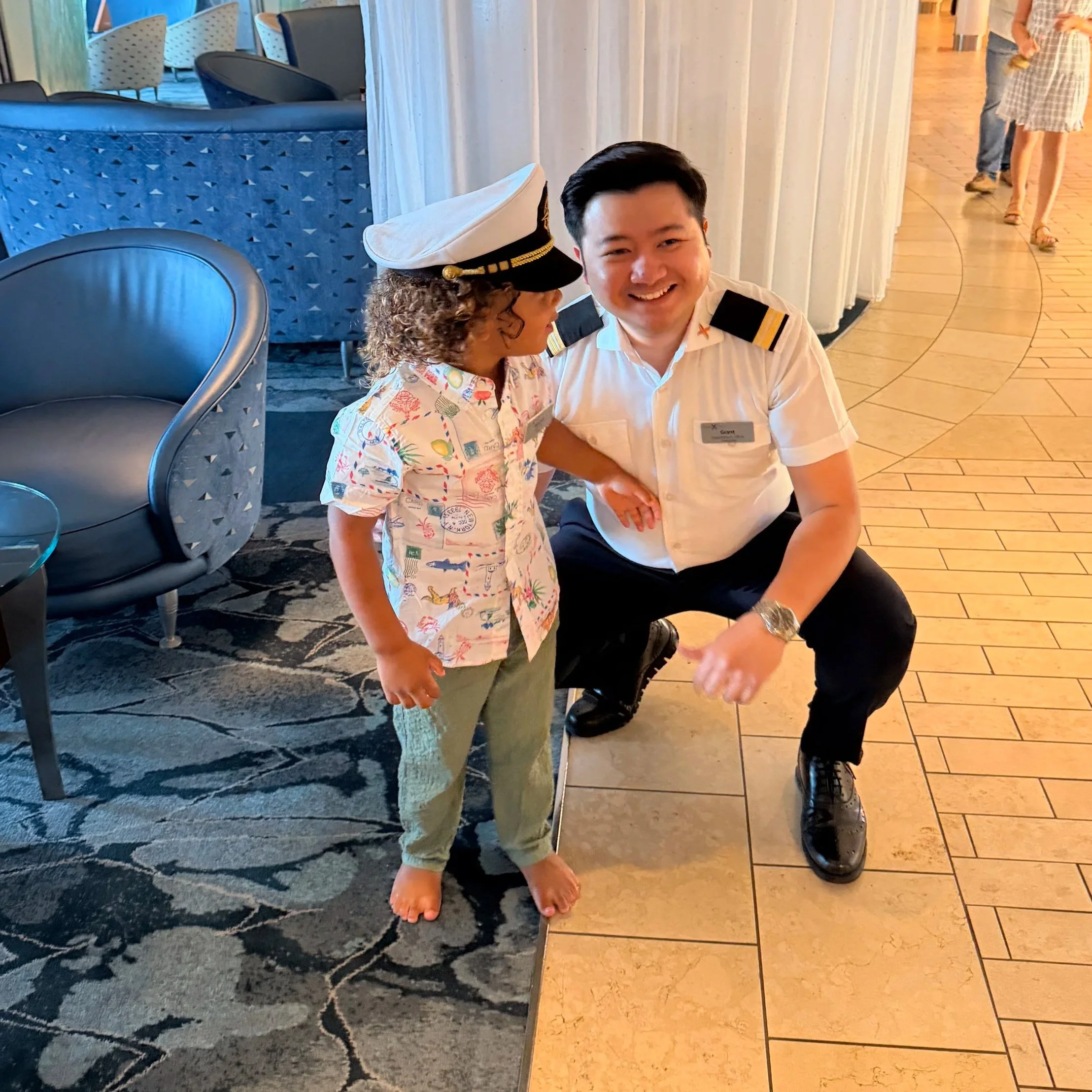 Three year old with Celebrity Equinox crew