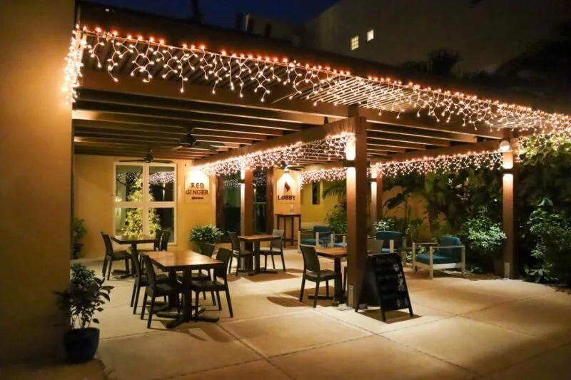 Red Ginger restaurant exterior on Front Street in San Pedro Belize at night.