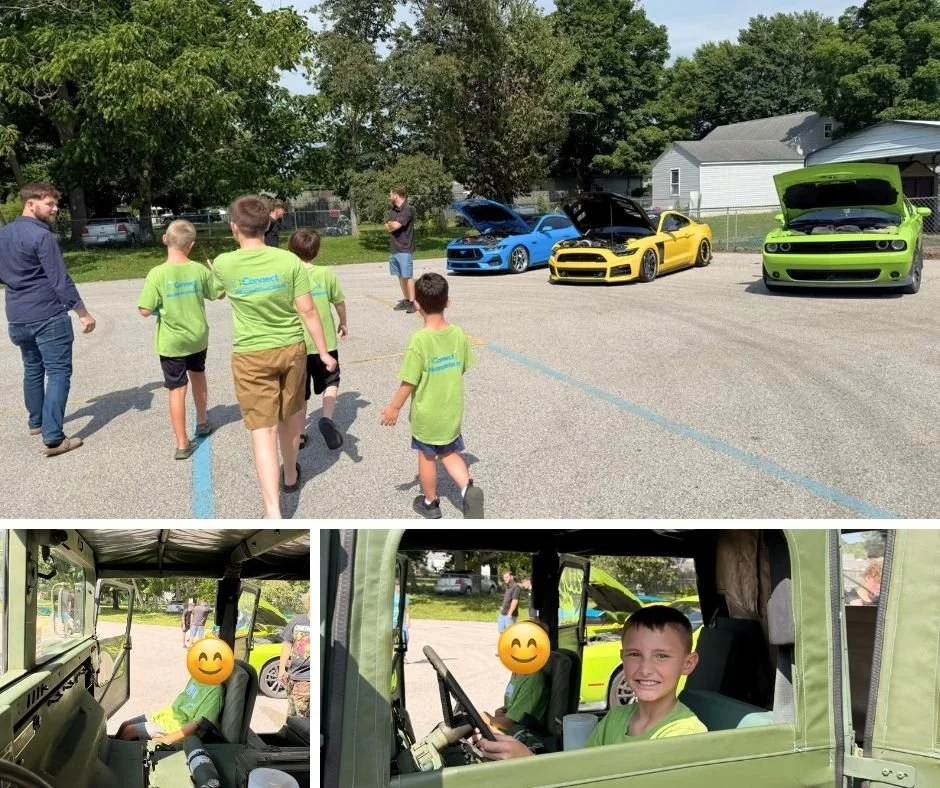 iconnect-car-show-walking-up-and-humvee.jpg