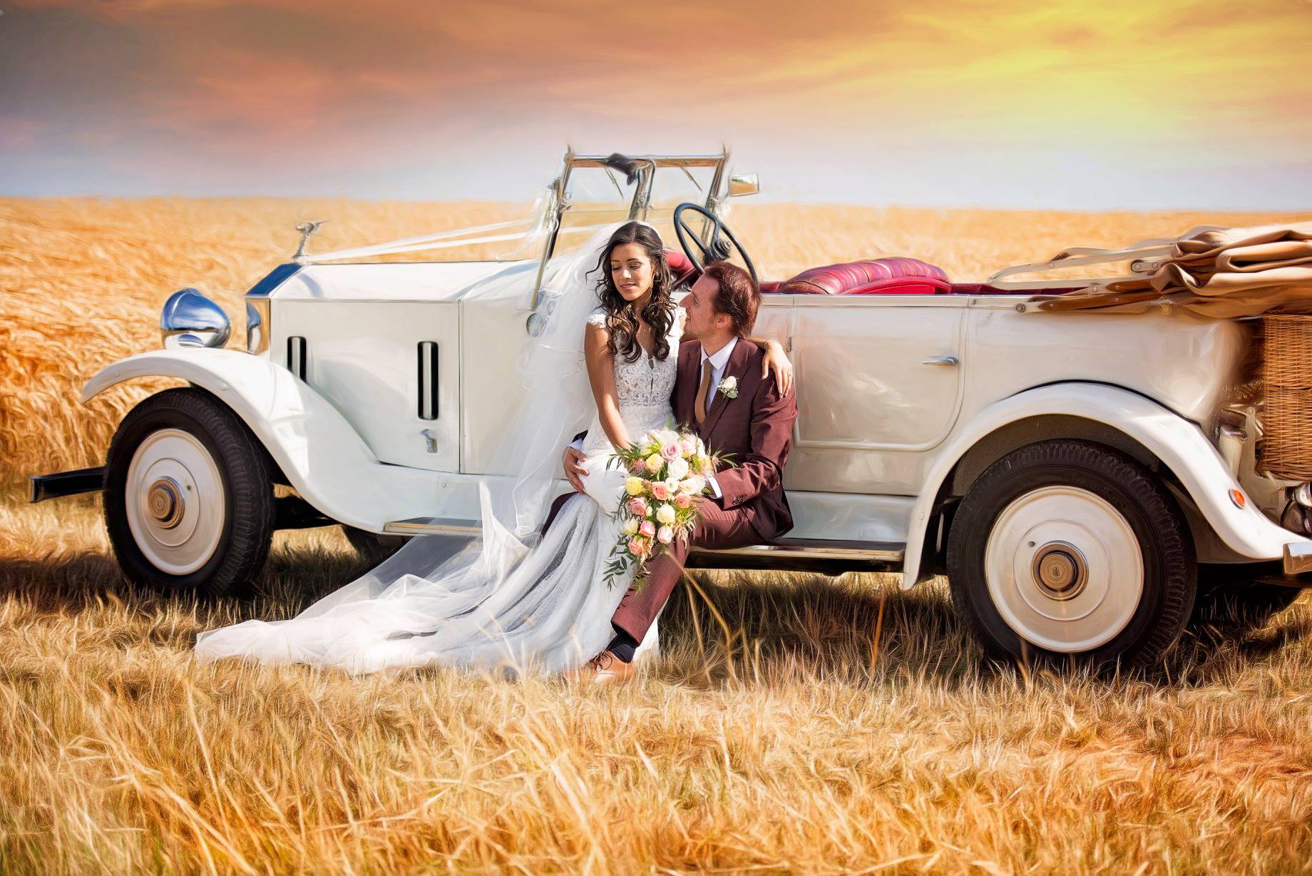 photo of bride and groom on a wedding classic car outside Tythe Barn, Oxfordshire. Edited and photographed by Wedding and portrait photographer Ovidiu Tiganus, based in United Kingdom 