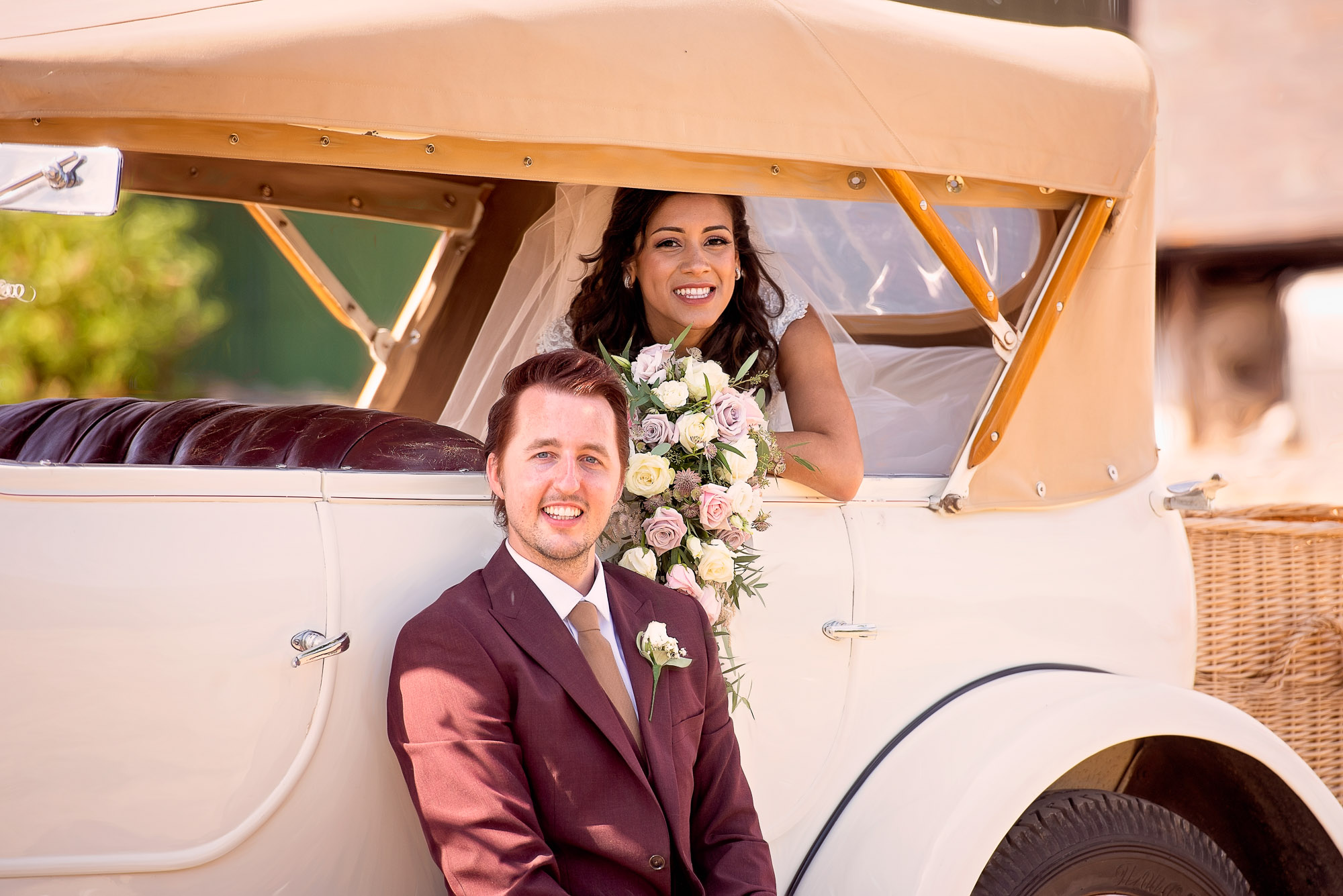 bride and groom with classic car photo