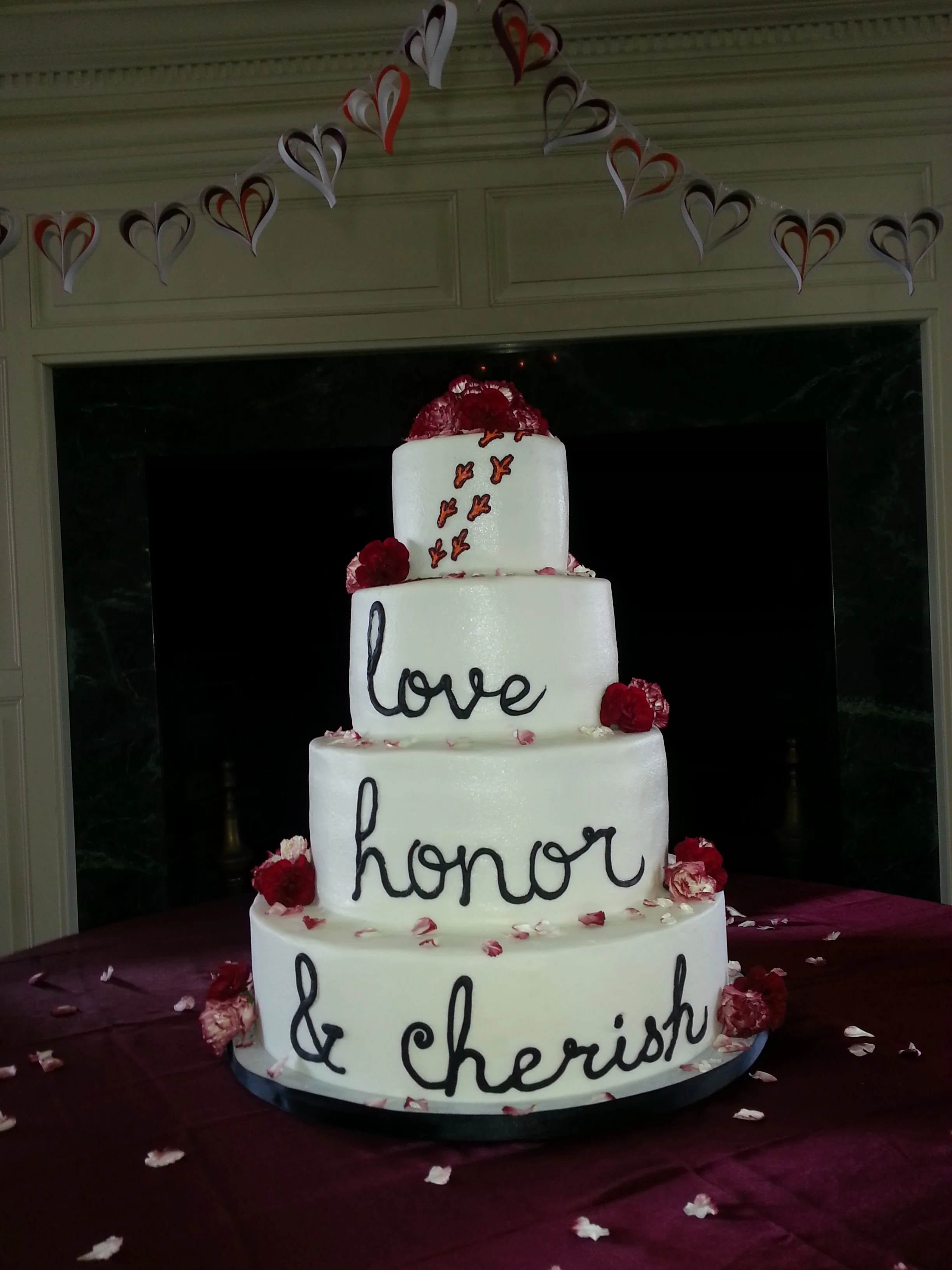 Maroon-themed, flowery wedding cake