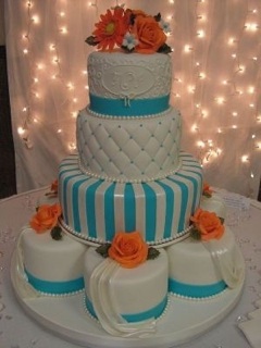 Light-blue with orange accented tufted-striped wedding cake with pearls