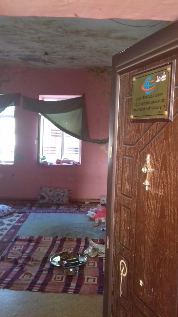 A Syrian couple with two kids from Kobani were given the old school of the village to settle down by the muhtar. They are not supposed to pay rent which gives them financial relief. Photo taken in Karakoyun village at Siverek by the author on 15 July 2018.