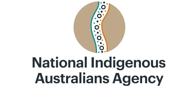 Logo of the National Indigenous Australians Agency with stylized circular and curved design.