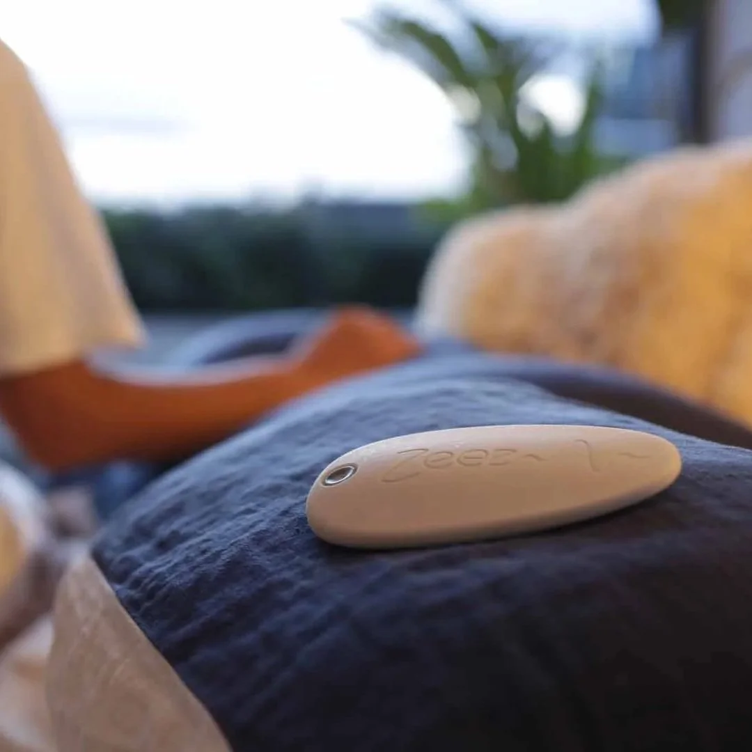 Zeez Sleep Pebble on a pillow