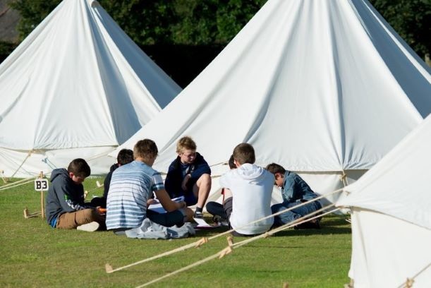 children on activity camp - camping in tents