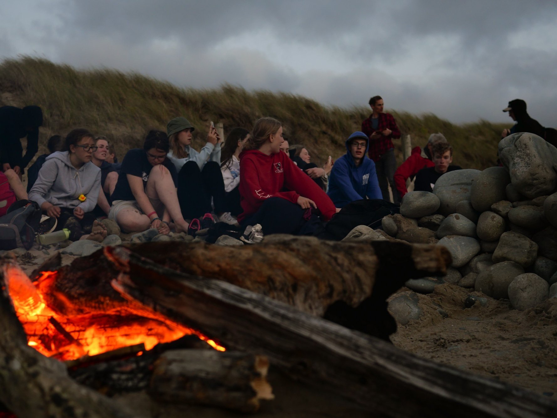 Young people love a campfire on the beach! 