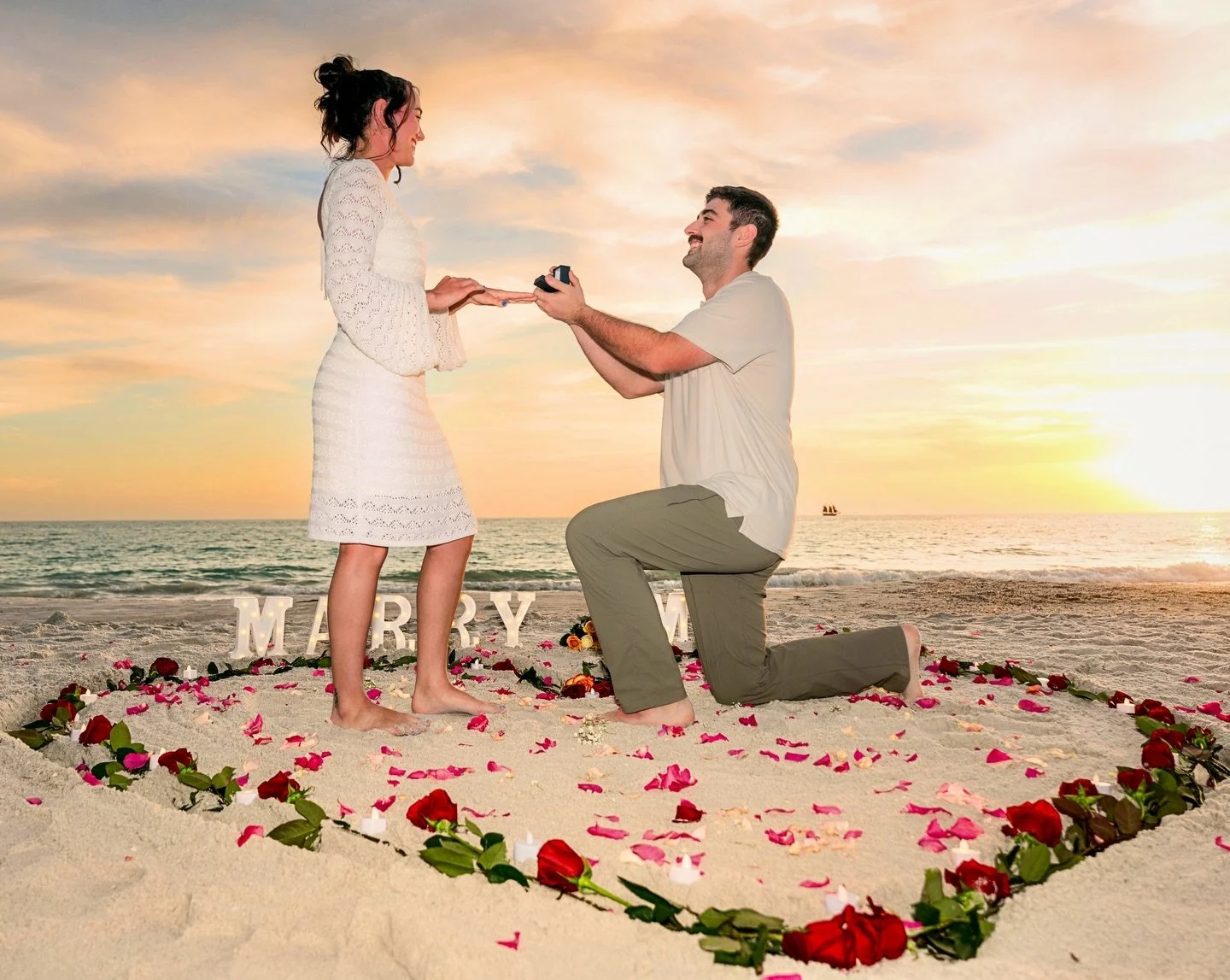Another beautiful surprise engagement everything was flawless even the sunset and the little red ship in the background. It was also great doing the set up and I feel like it created a sense of natural beauty. What do you think?