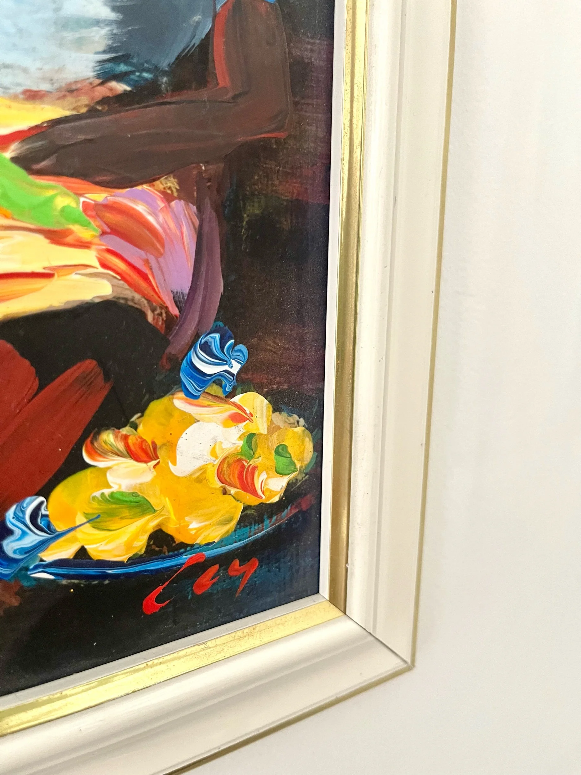 Marchande Kreyol de fruits et légumes se reposant sur une chaise avec son chapeau en paille sur la visage.